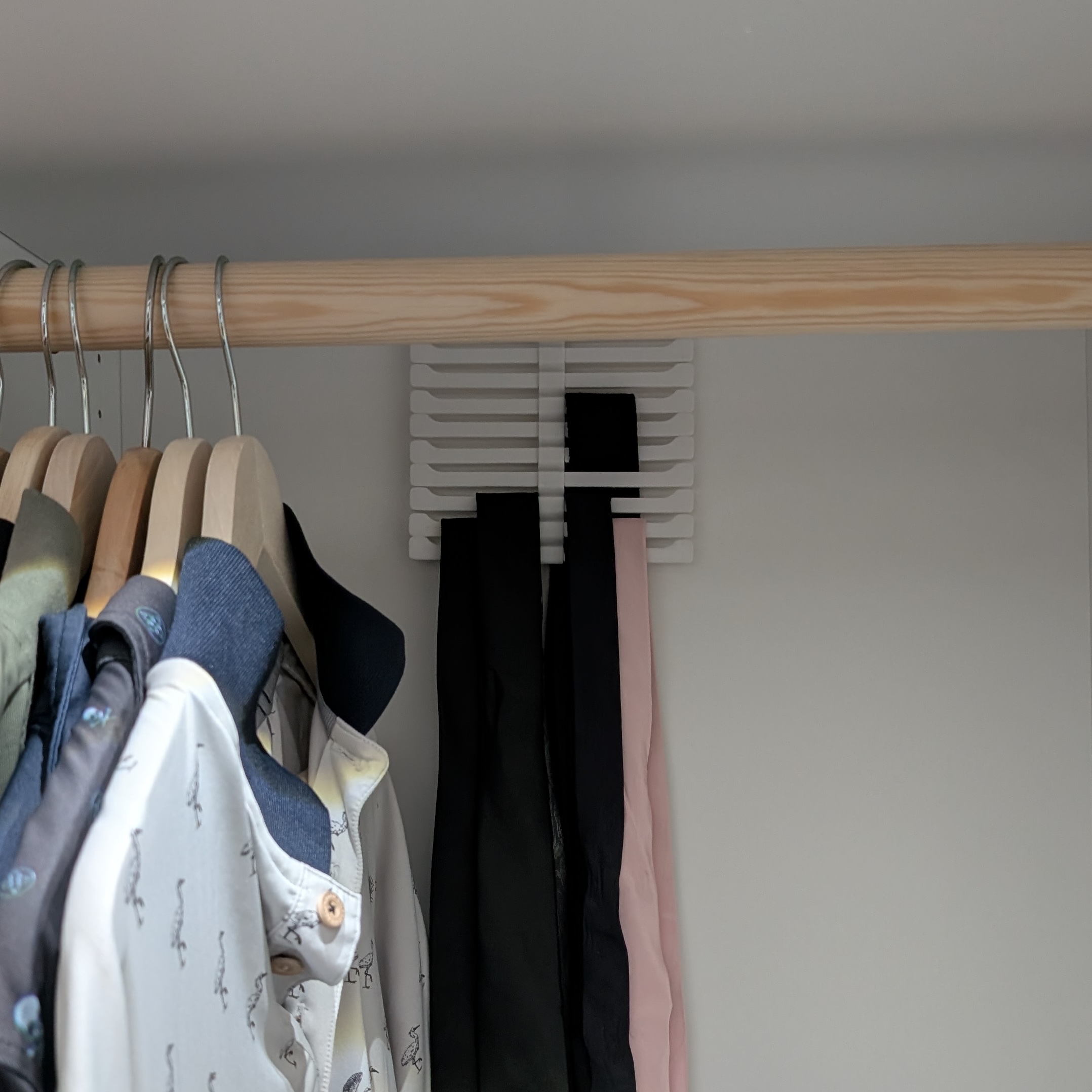Under shelf , back of closet, space saving holder/hanger for ties/belts etc