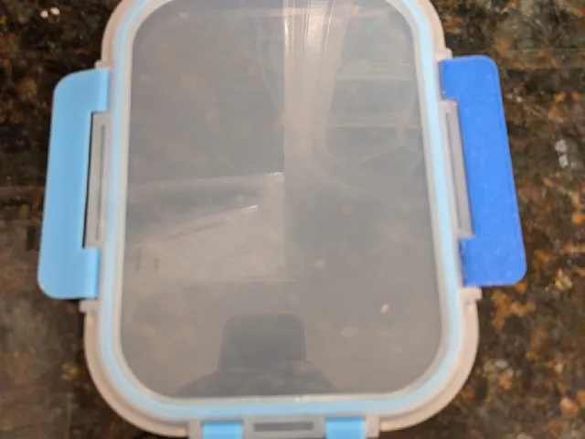 Glass food storage contain lid clip part (I believe the brand is ello but not 100% sure)
