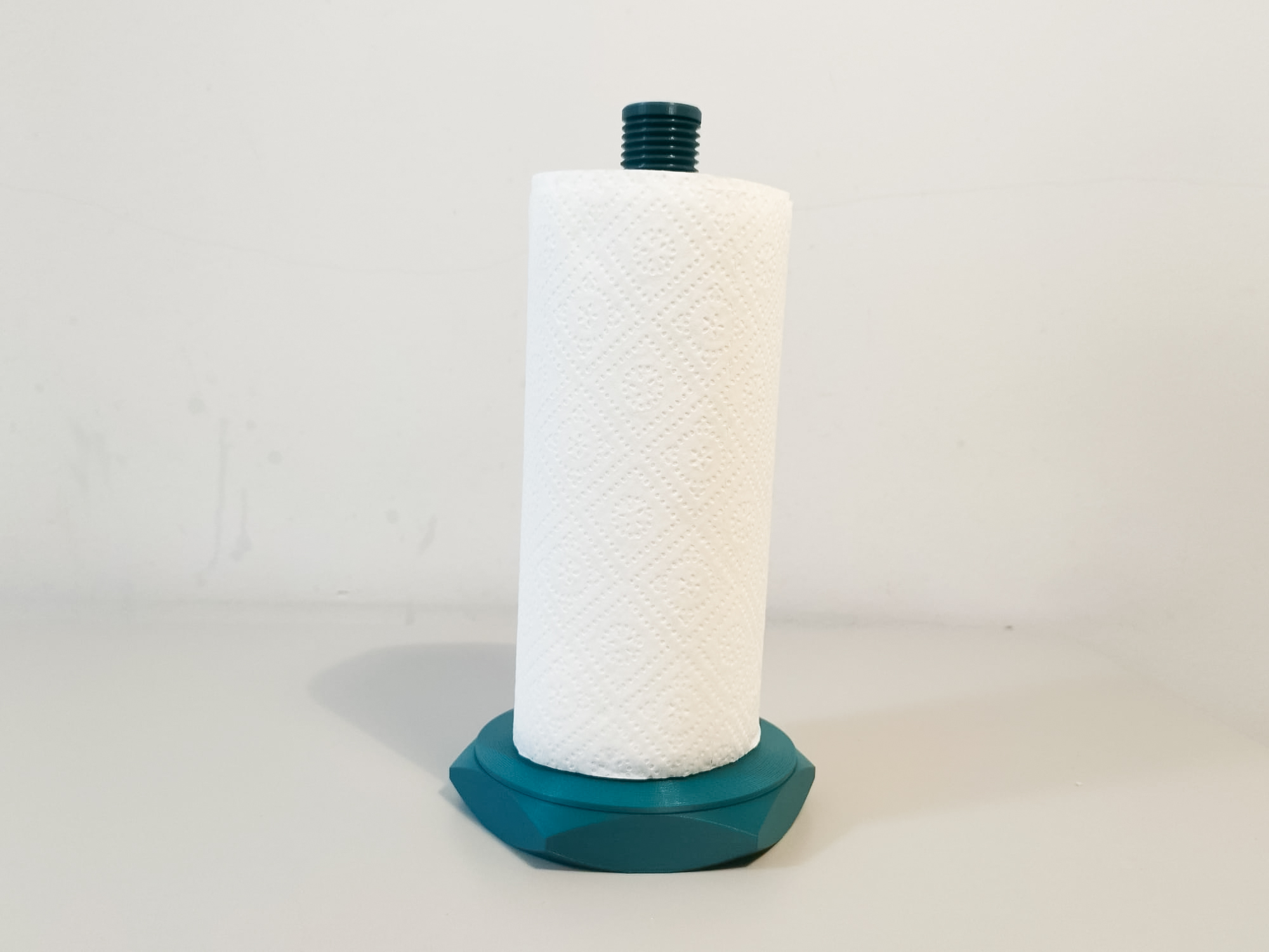 Industrial-style paper towel holder.