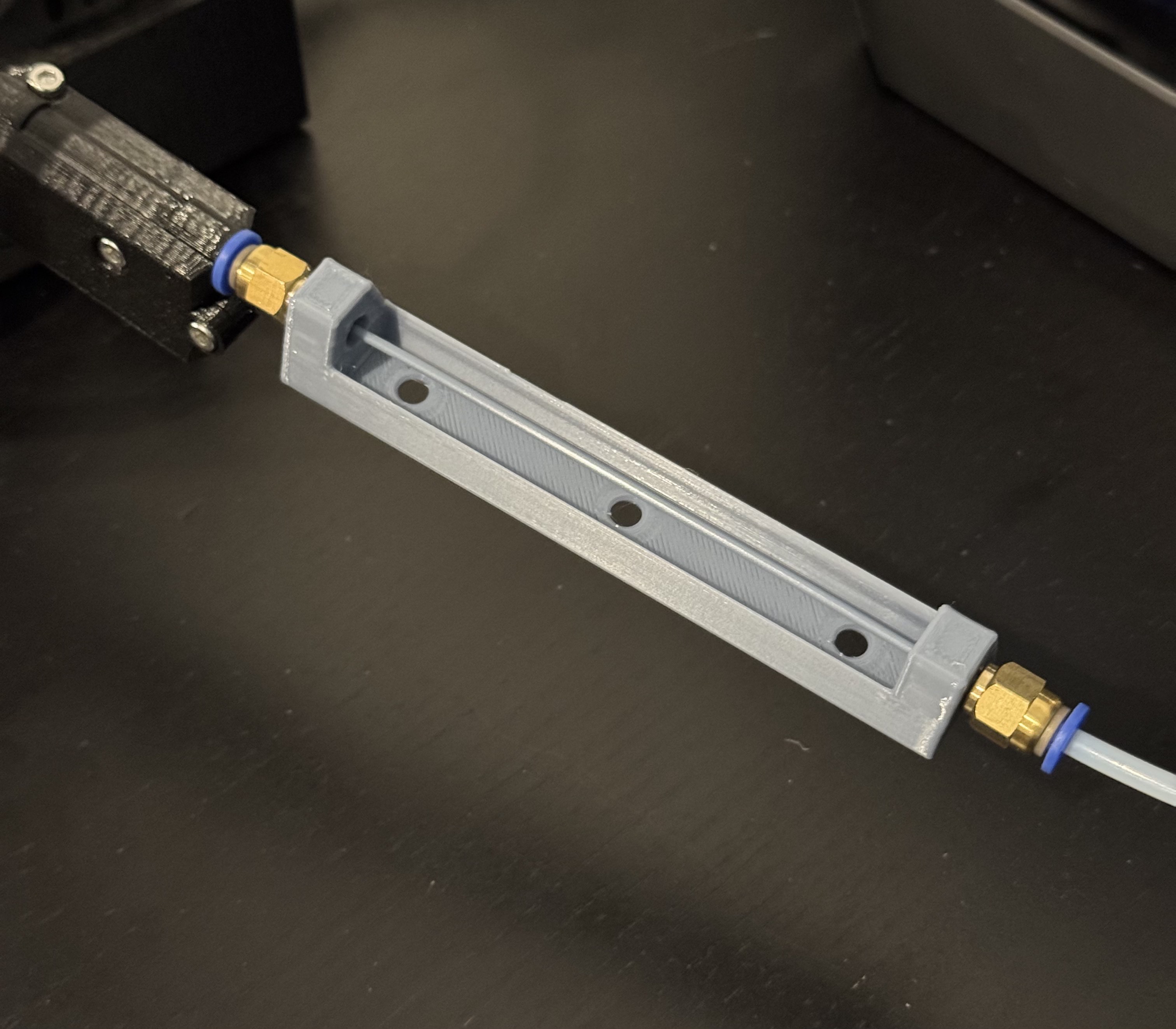 PTFE tube coupler with retraction buffer