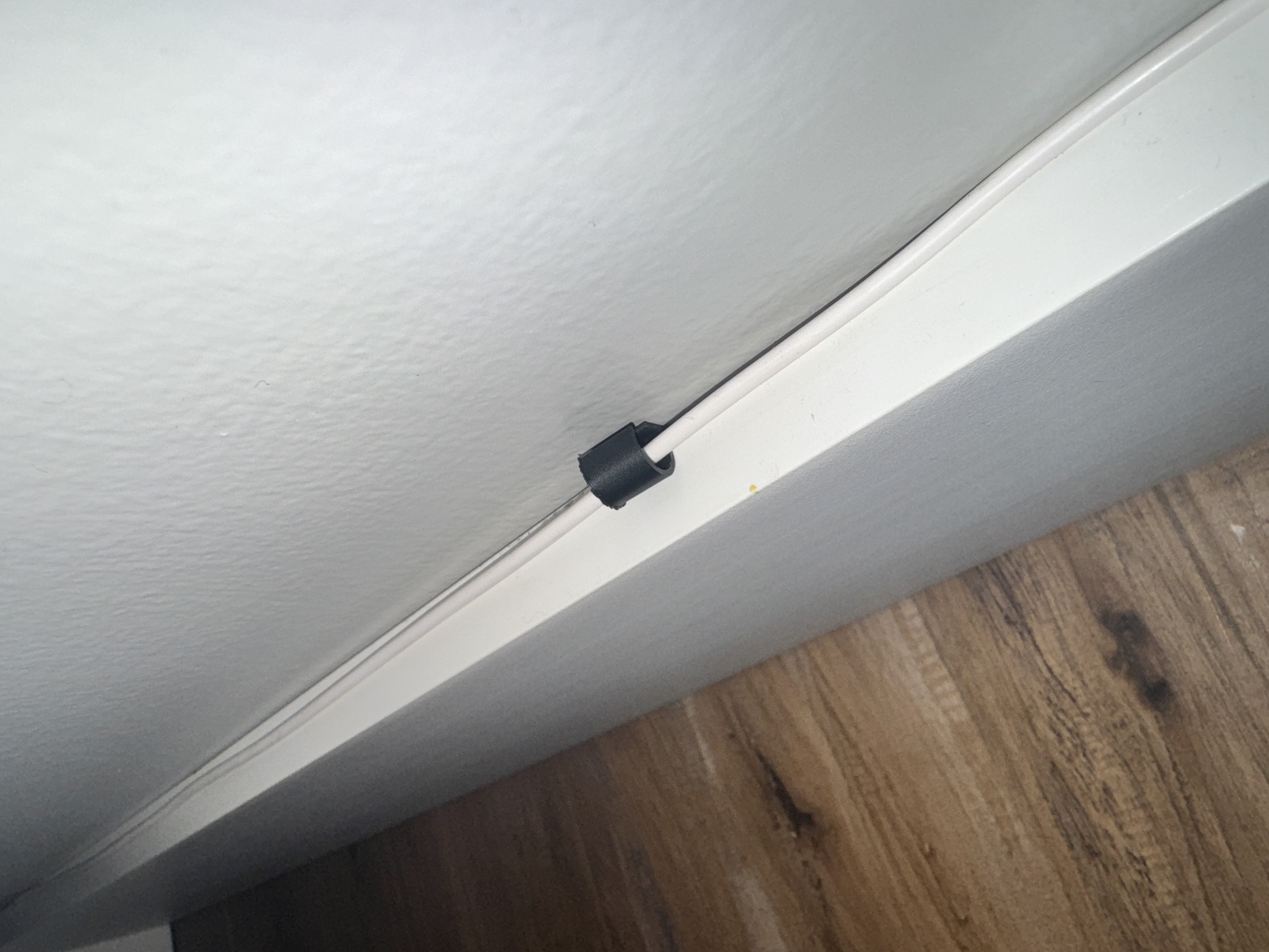 Baseboard cable guide