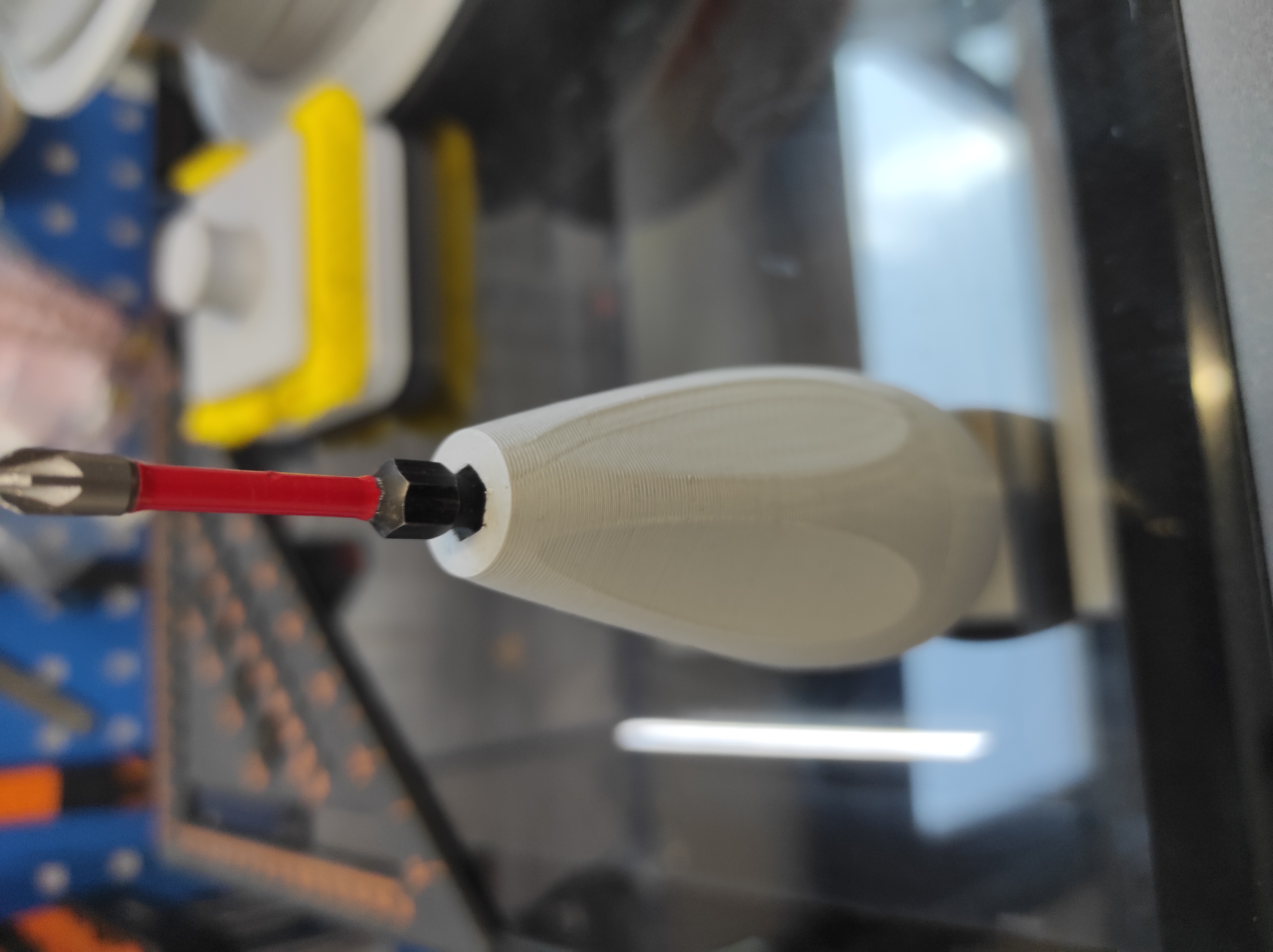 Bit holder ergonomic with tiny pocket