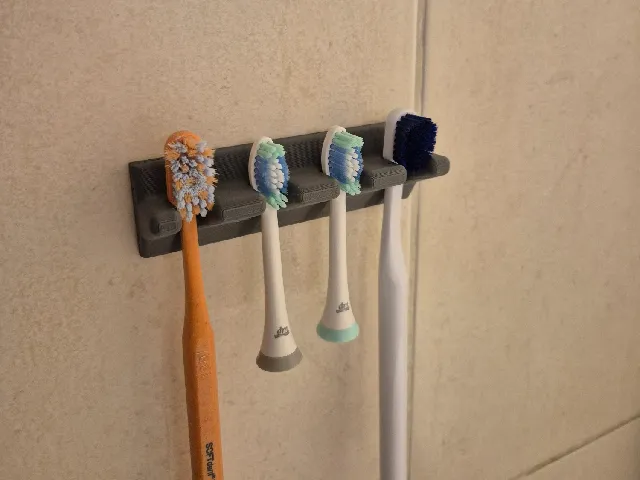 Detachable toothbrush holder