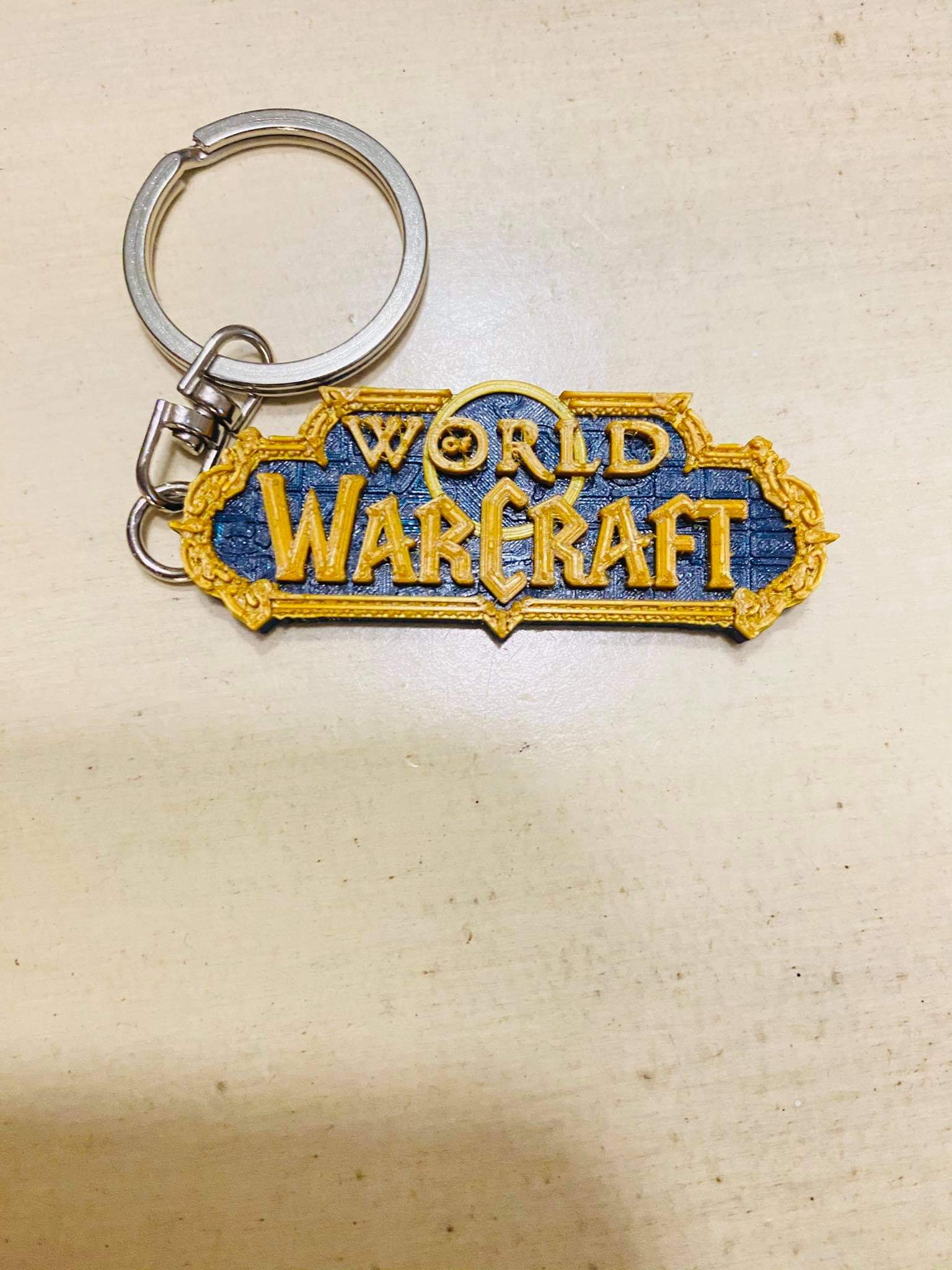 World of Warcraft logo keychain