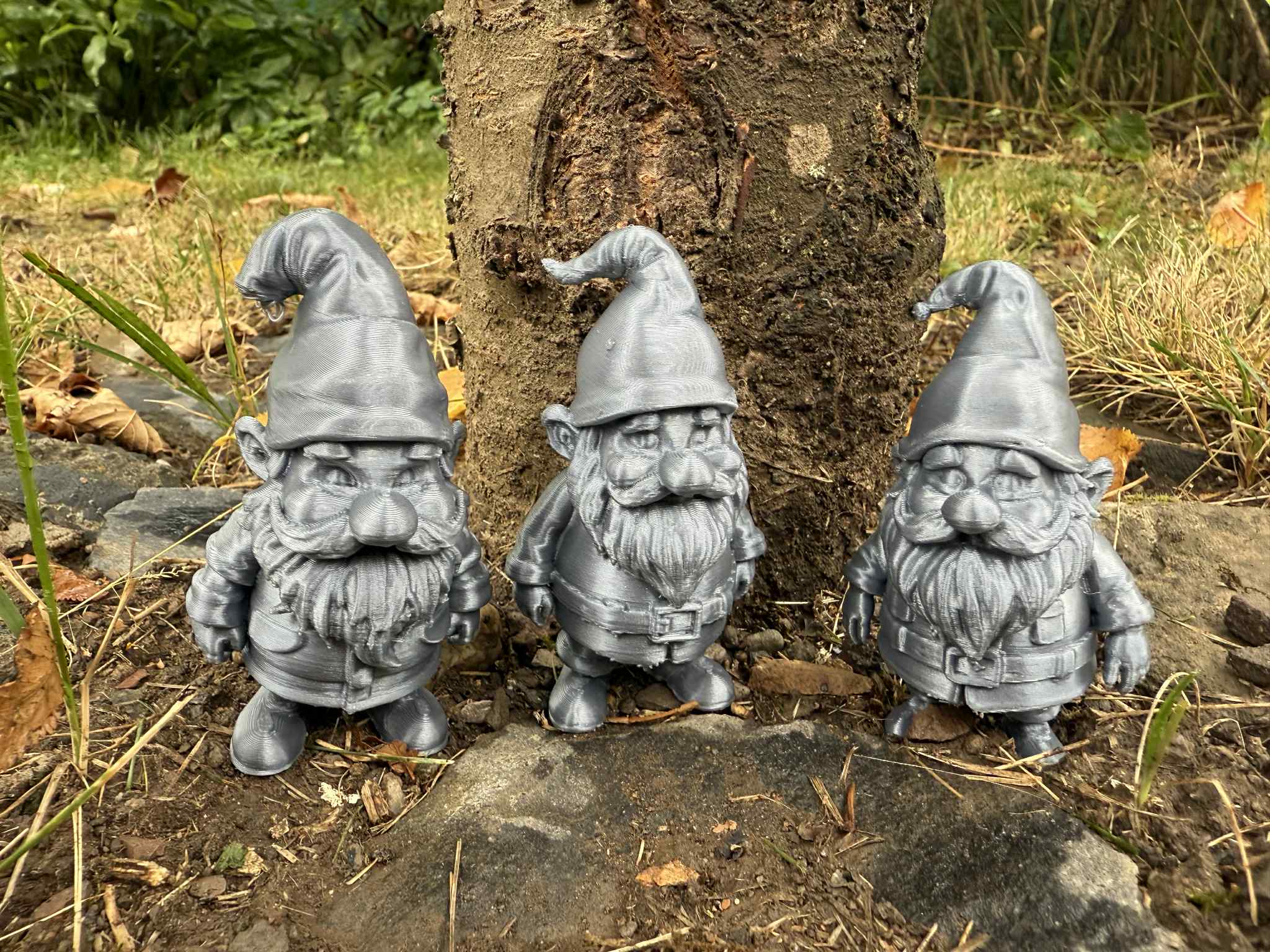 3 garden gnomes, hobbits