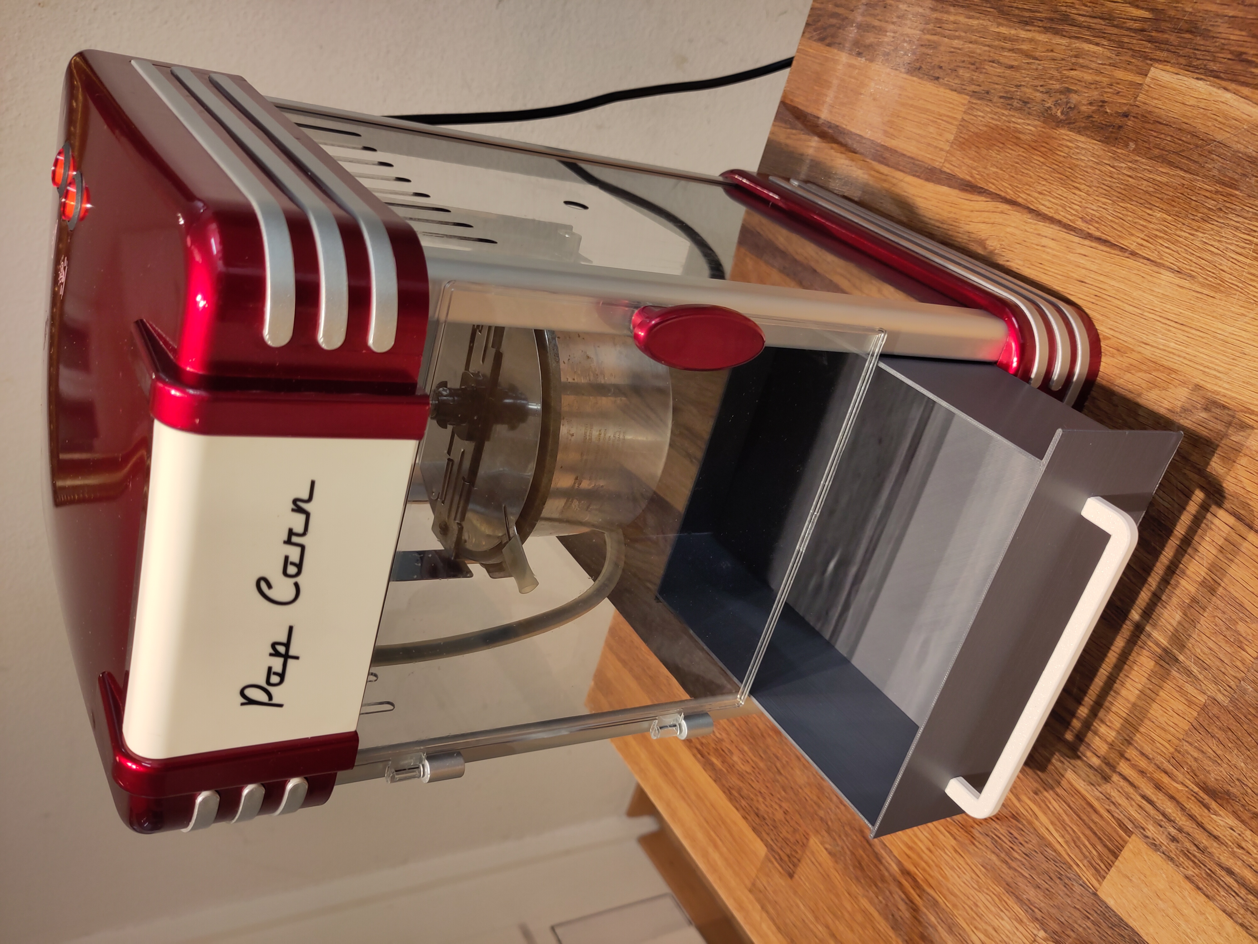 Popcorn machine drawer with handle