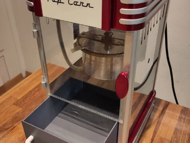 Popcorn machine drawer with handle