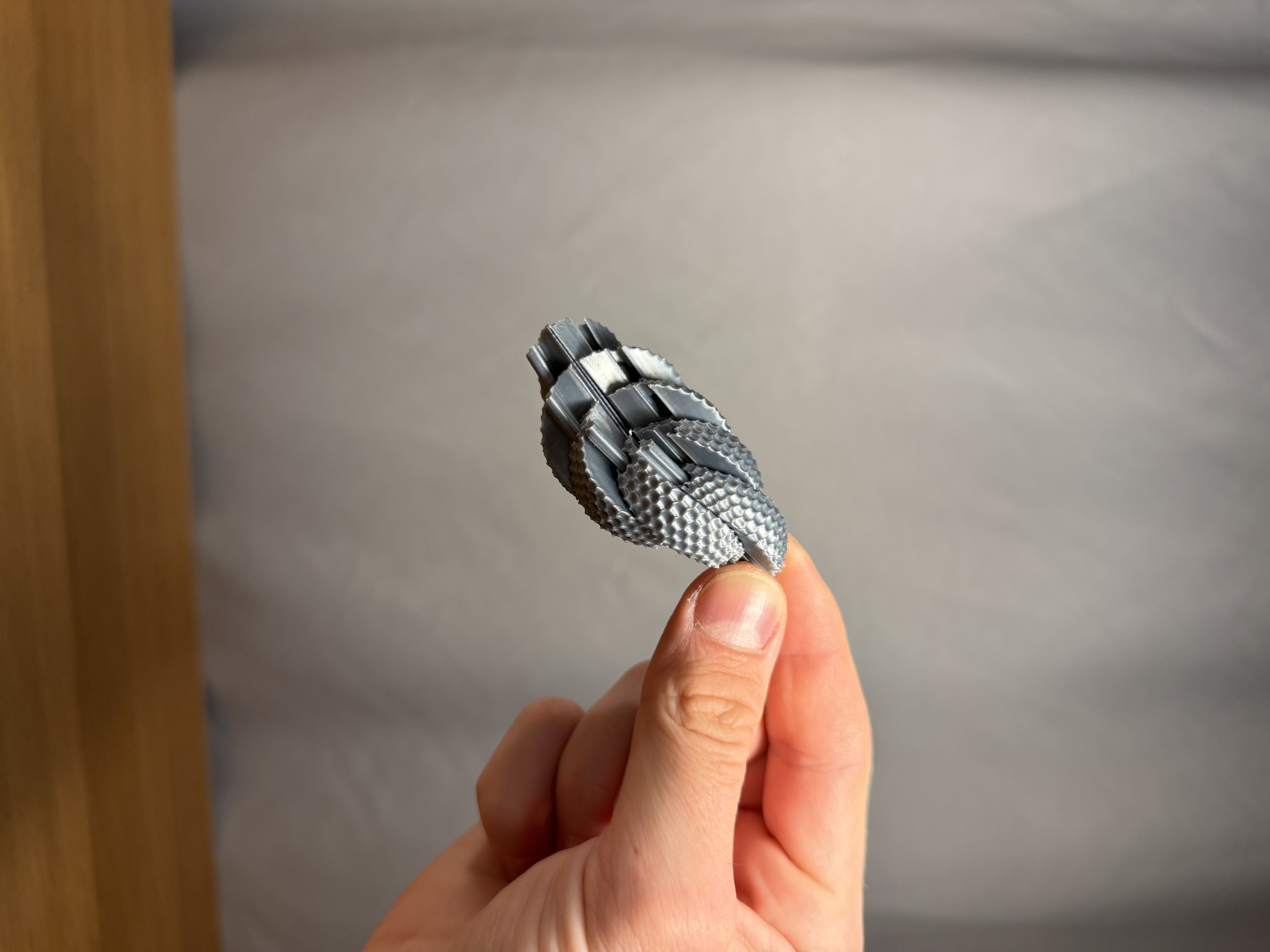 Miniatura 3 do modelo 3D Mini Dimpled Sensory Sphere Twisty Fidget Toy