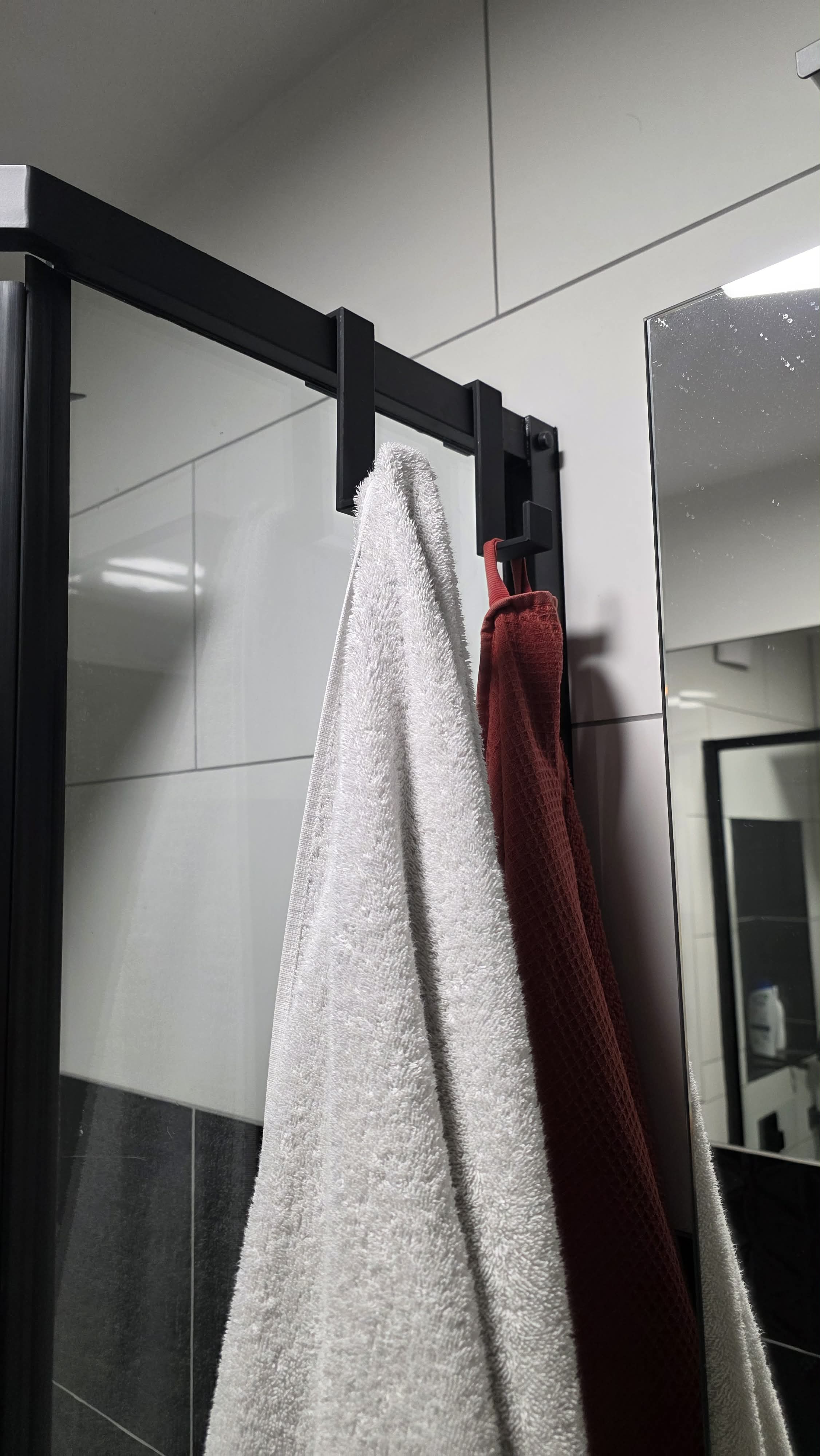 Shower cabin towel hanger