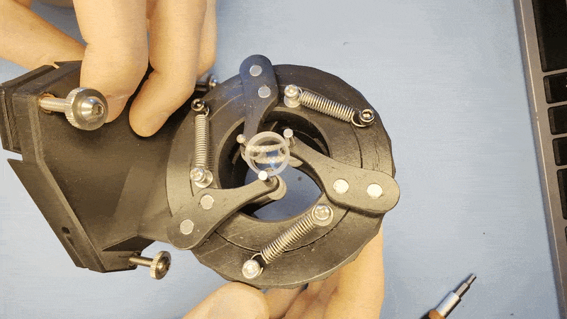 Self centering cylinder / lens holder with stand