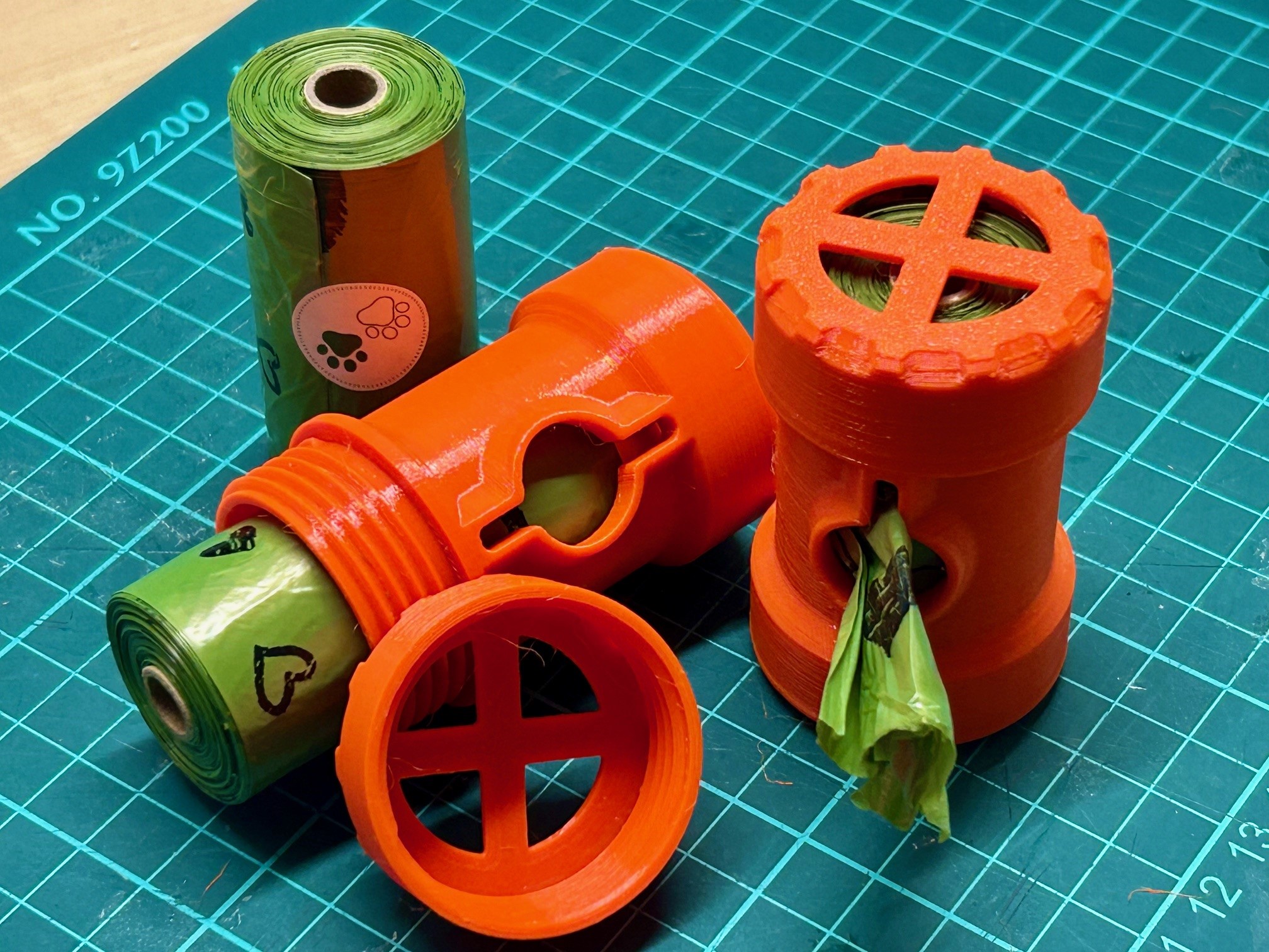 Ultra compact poo bag dispenser / holder