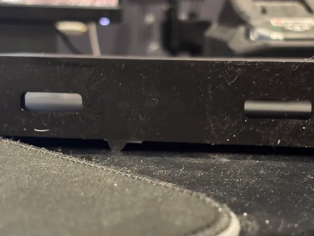 Phone wall mount with hole for charger