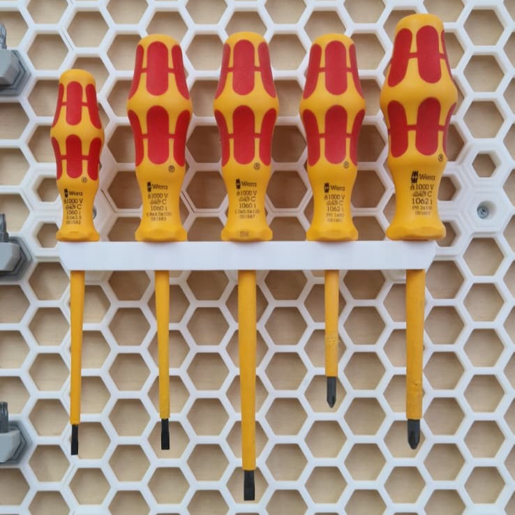 Screw driver holder for honeycomb storage wall