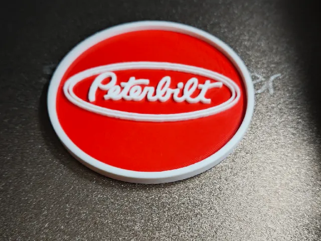 A Peterbild logo coaster