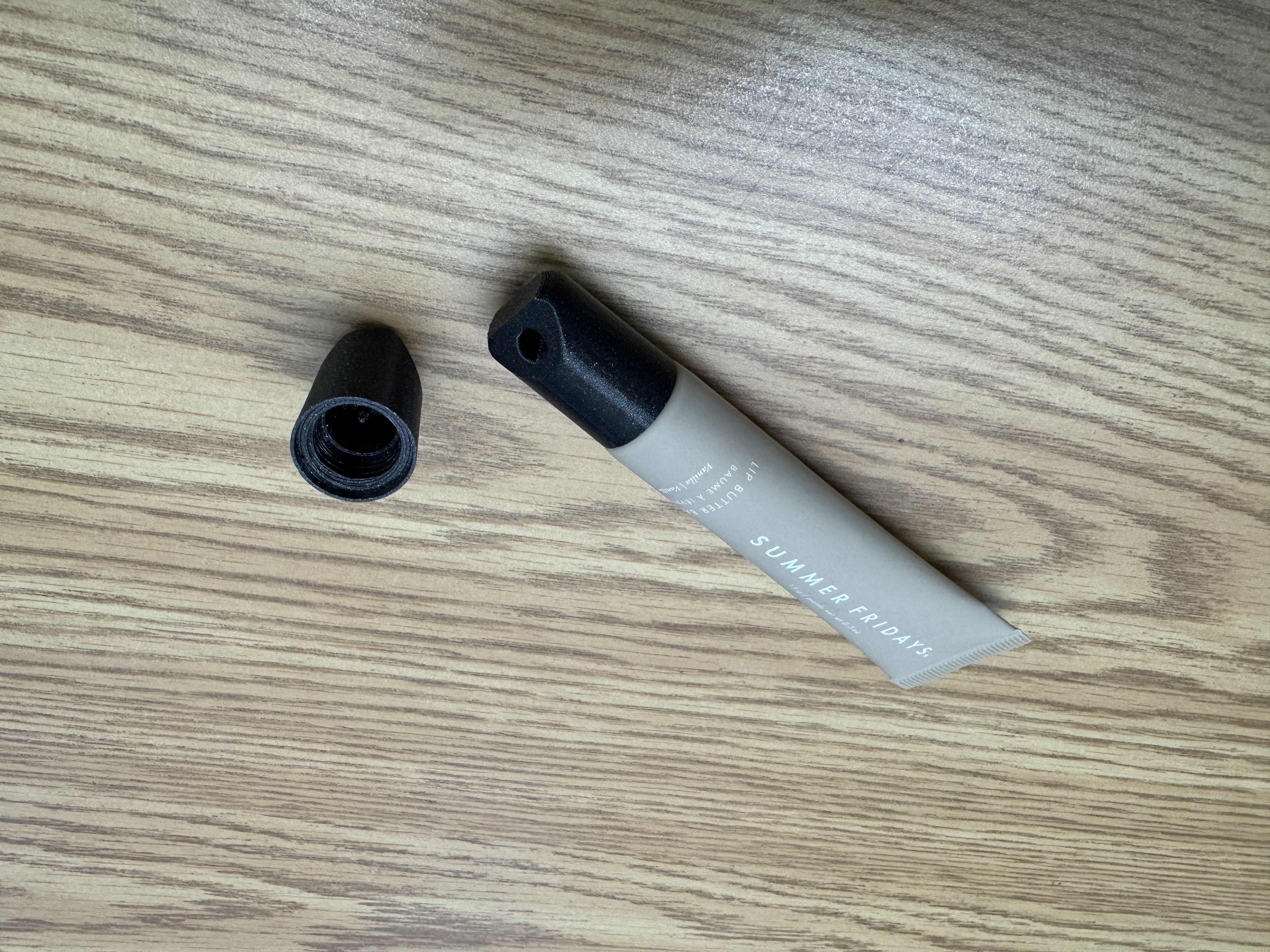 Lip gloss screw on cap with key ring hole