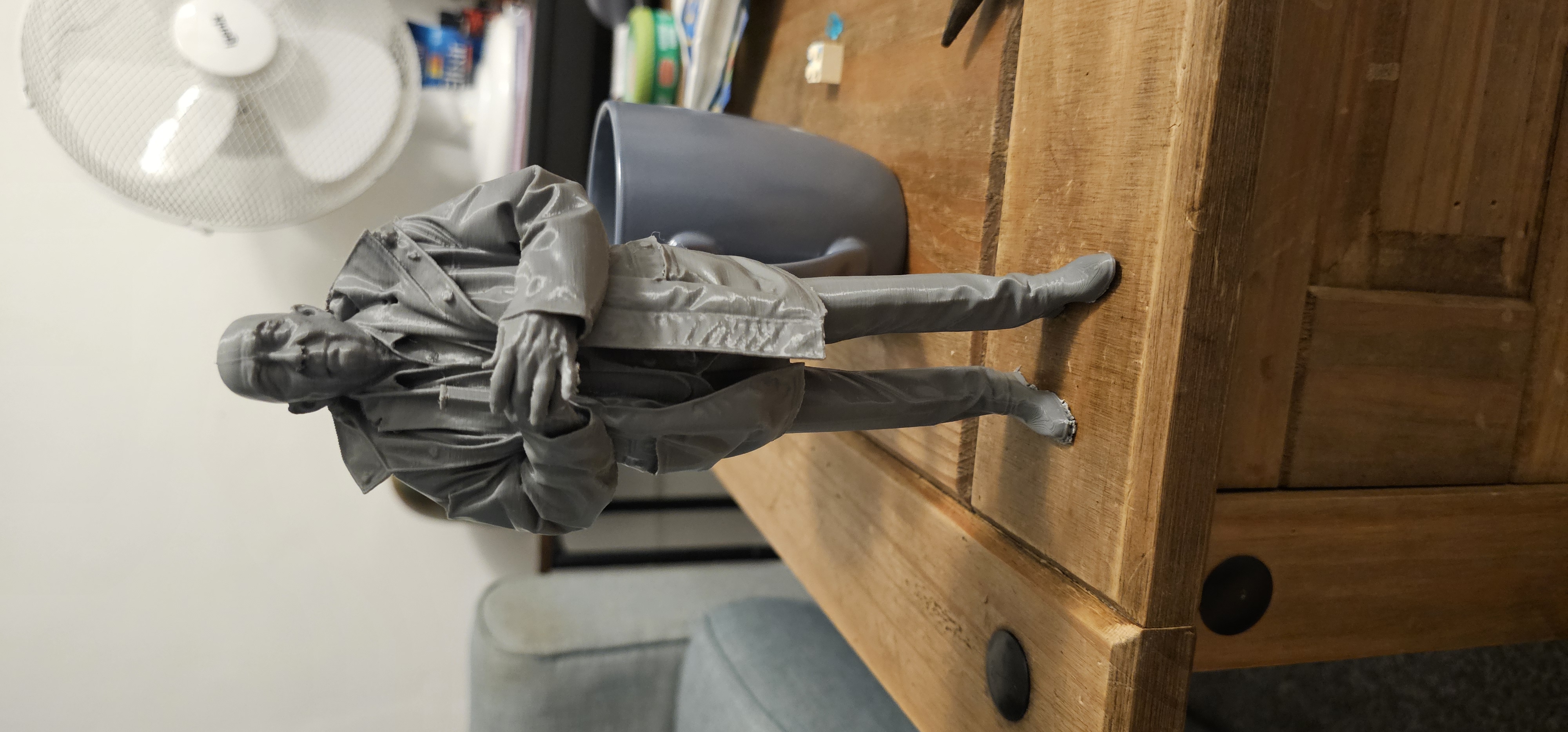 Weathered old man figurine
