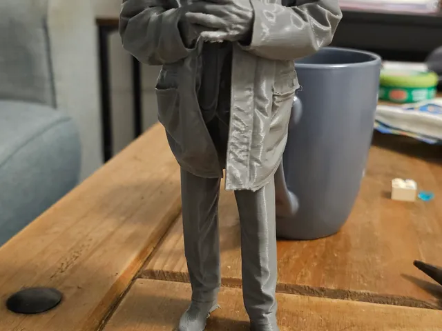 Weathered old man figurine
