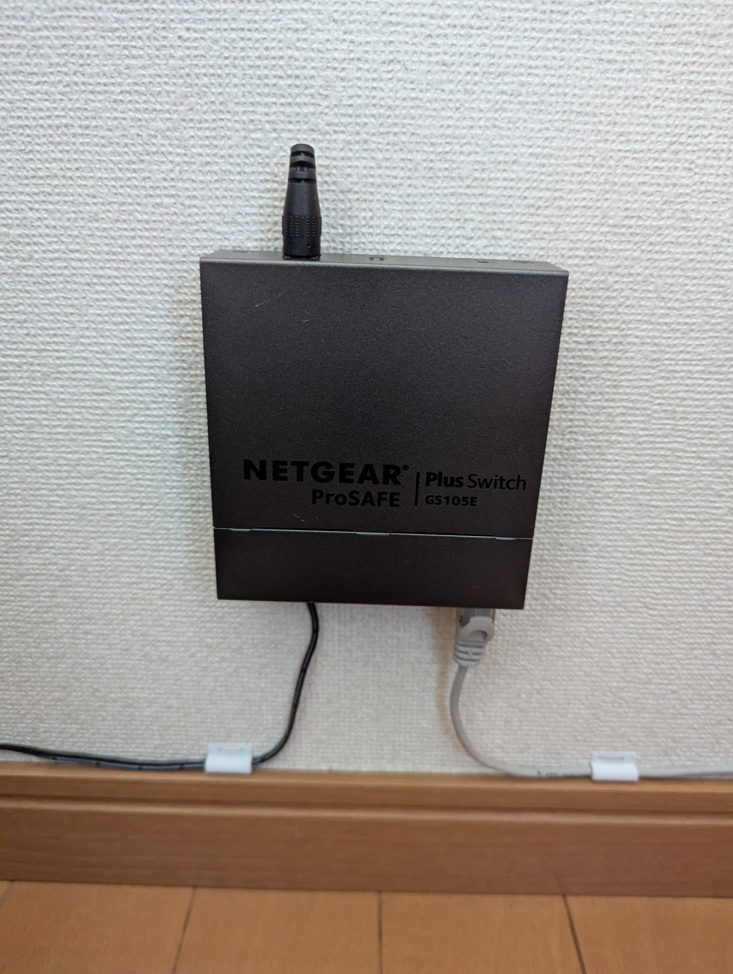 Staple-on wall mount for the Netgear GS105E
