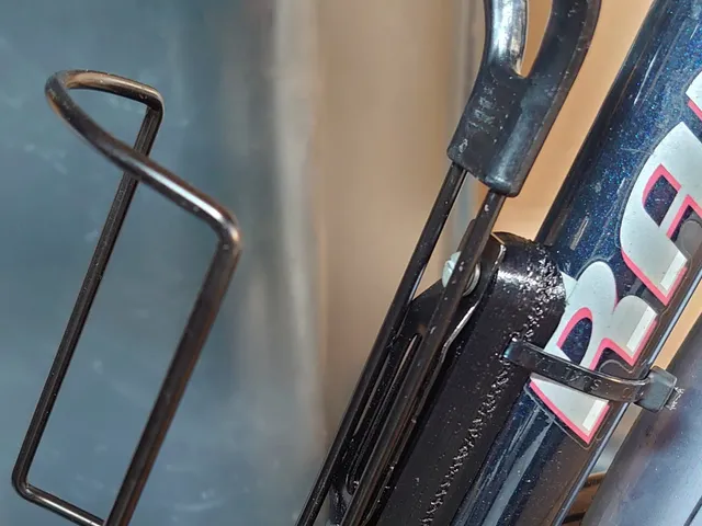 Bicycle bottle cage mount with nuts