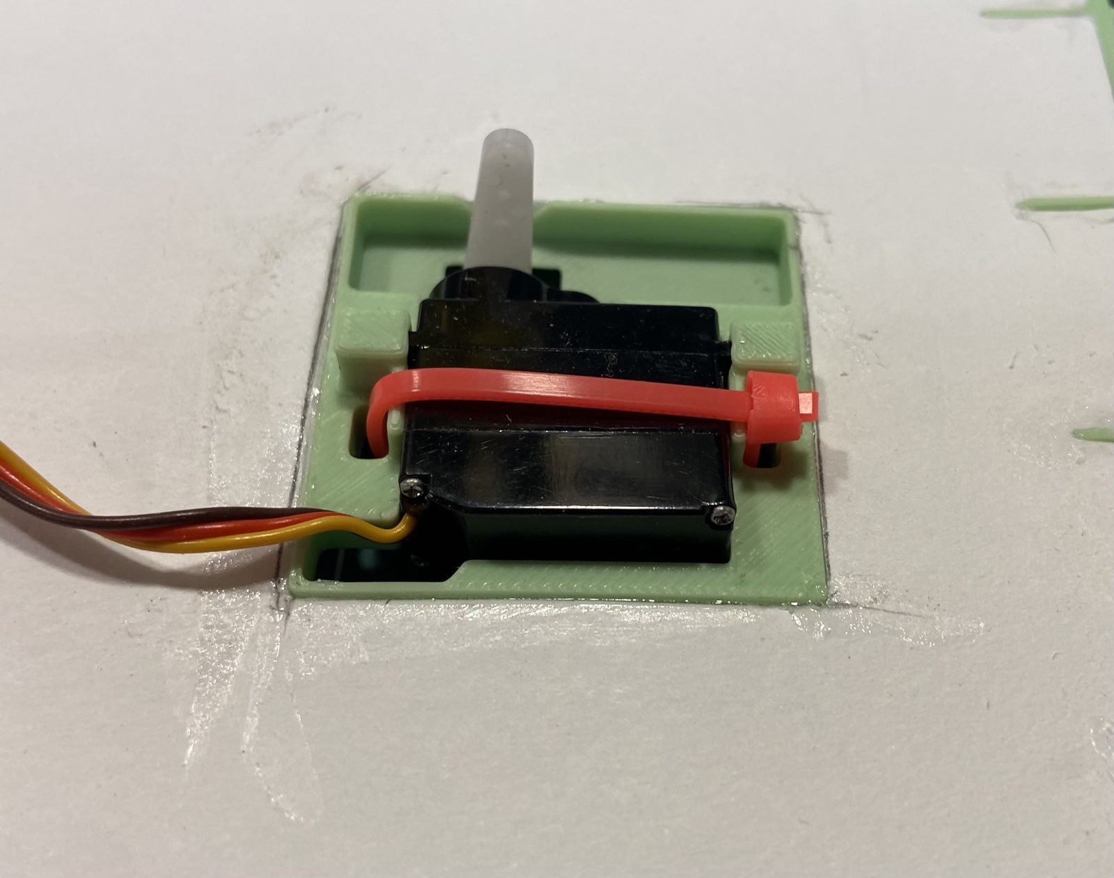 Mounting bracket for EMax R/C airplane servo