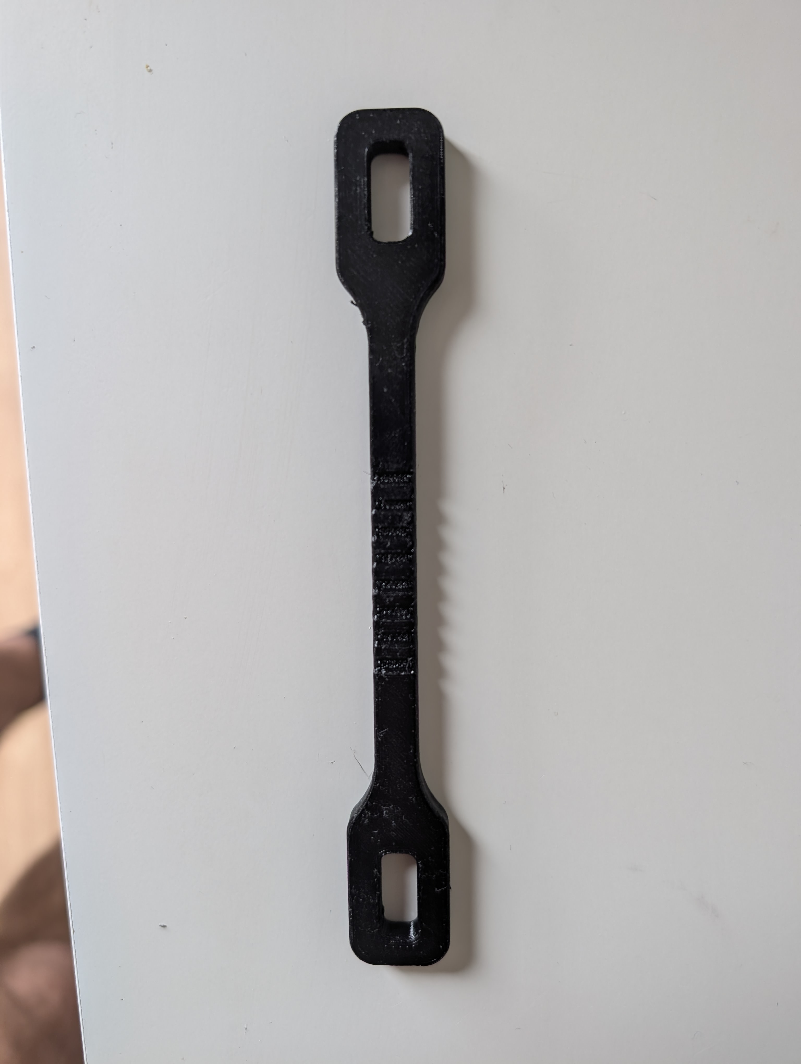 Climbing anti carabiner cross load band