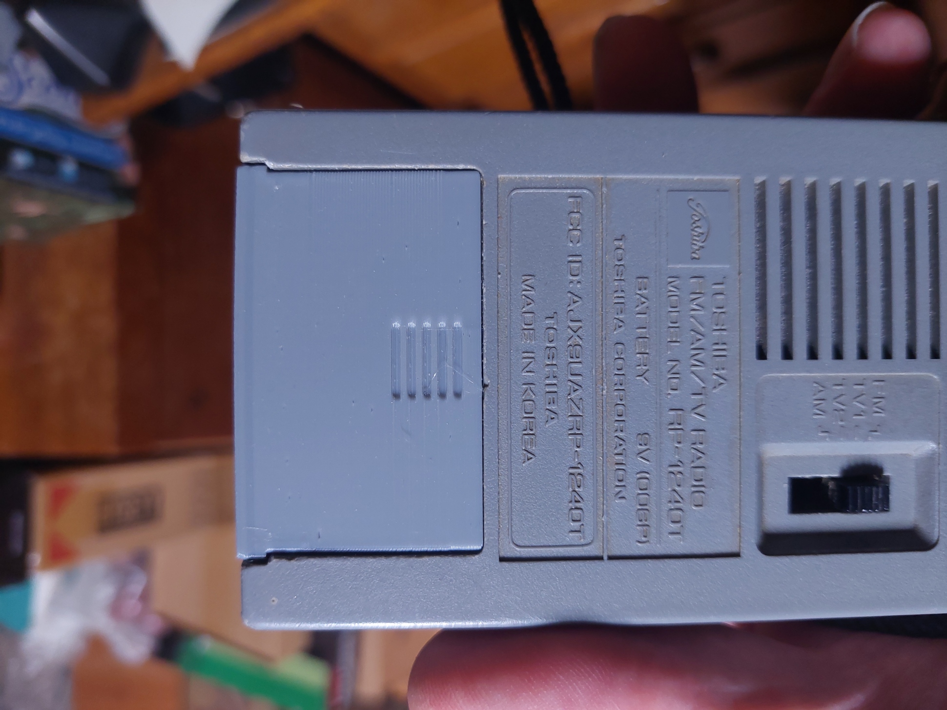 Battery cover for Toshiba transistor radio.