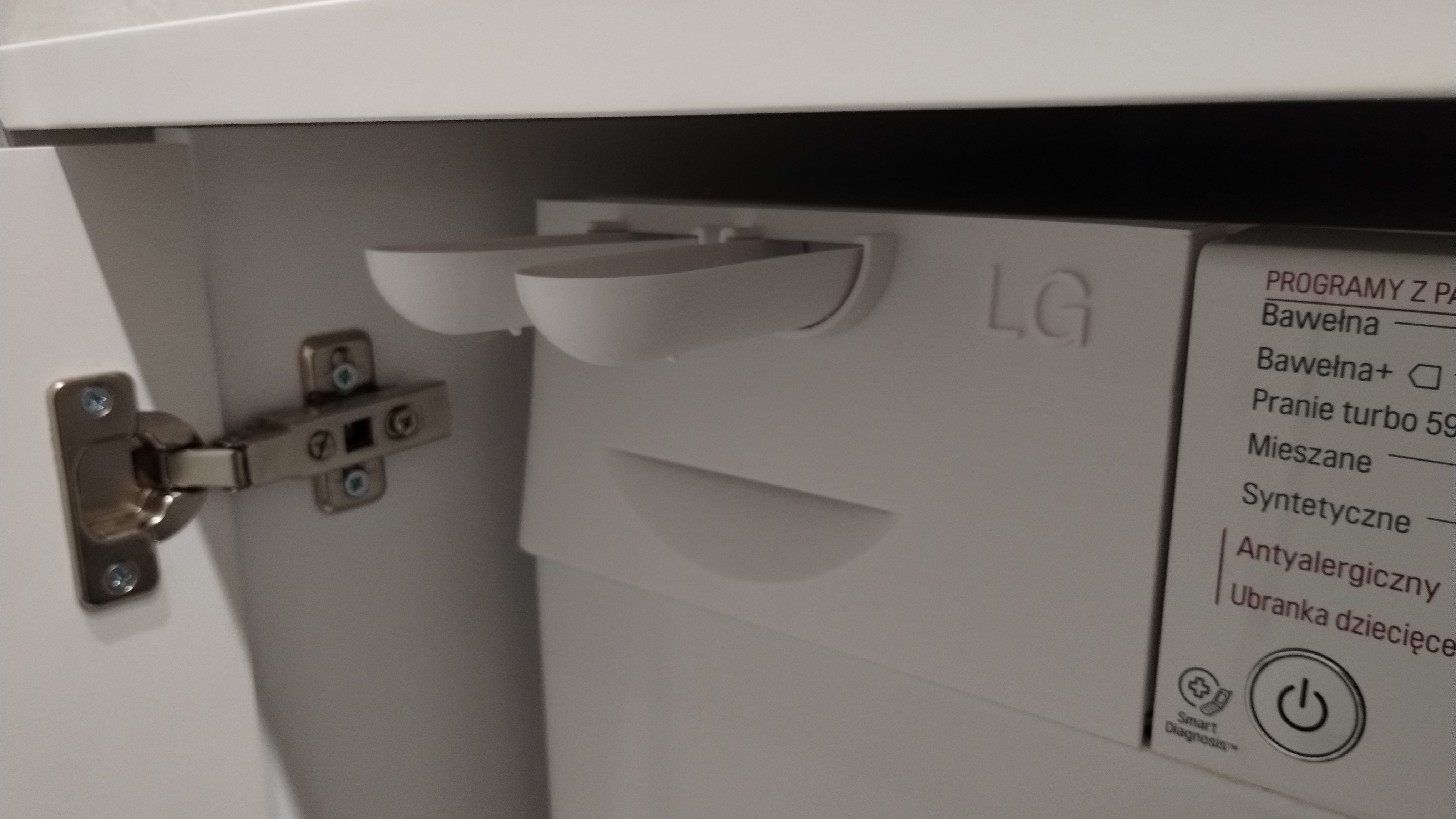 Washing machine liquids drawer front