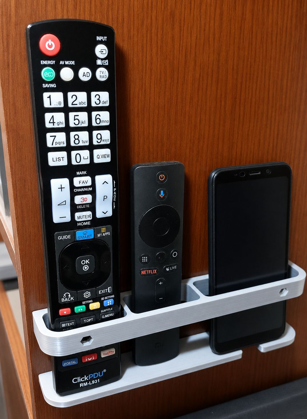 Adjustable Wall-Mounted Holder for Remote Controls and Smartphone