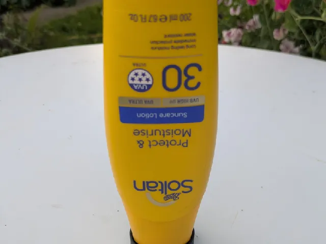 Suntan lotion upside down stand