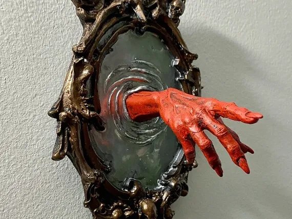 hand coming through portal