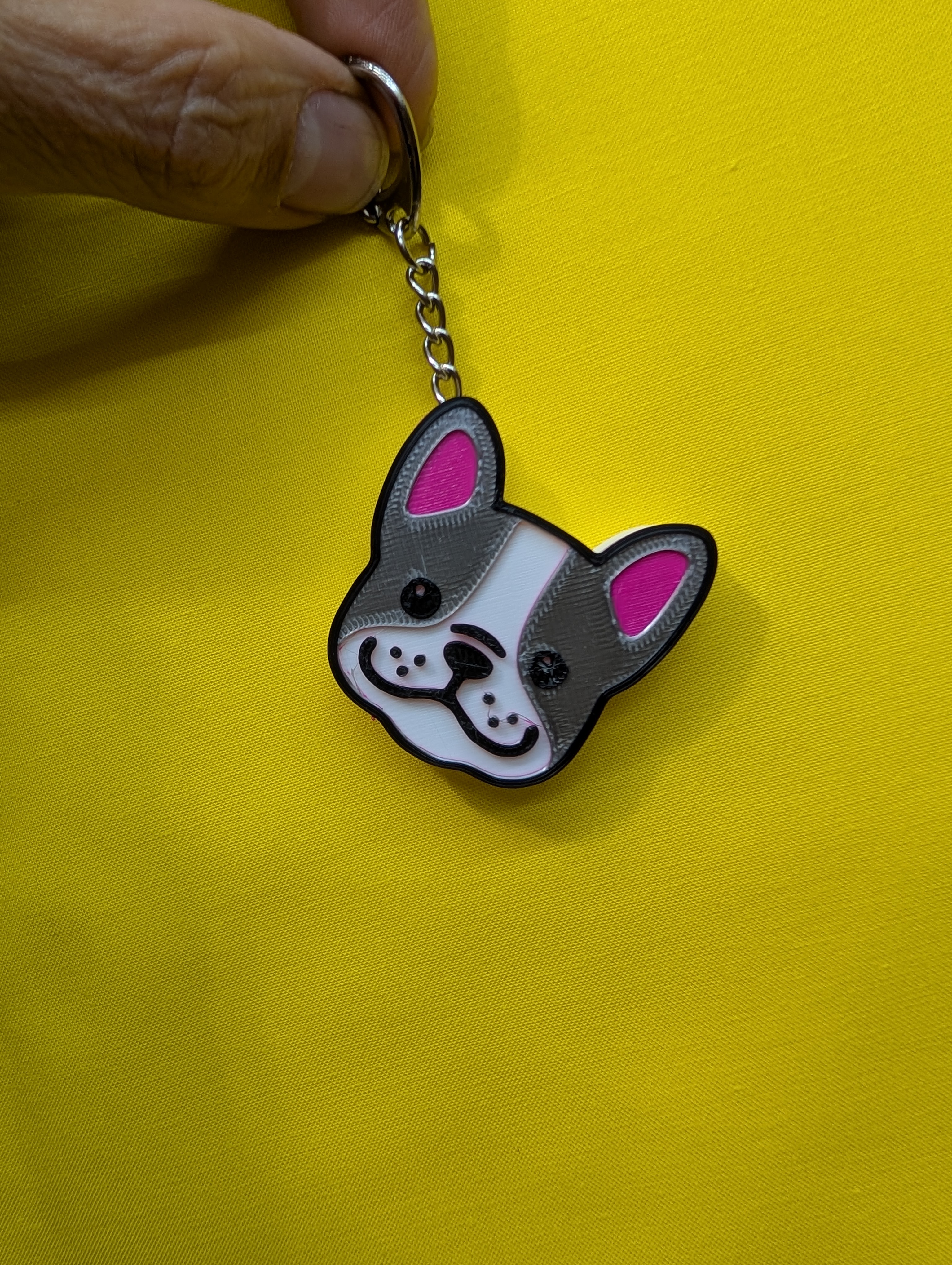 French Bulldog Pug Dog Keychain with  keychain inserted into the model
