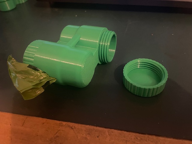 Dog poo bag and treat holder.