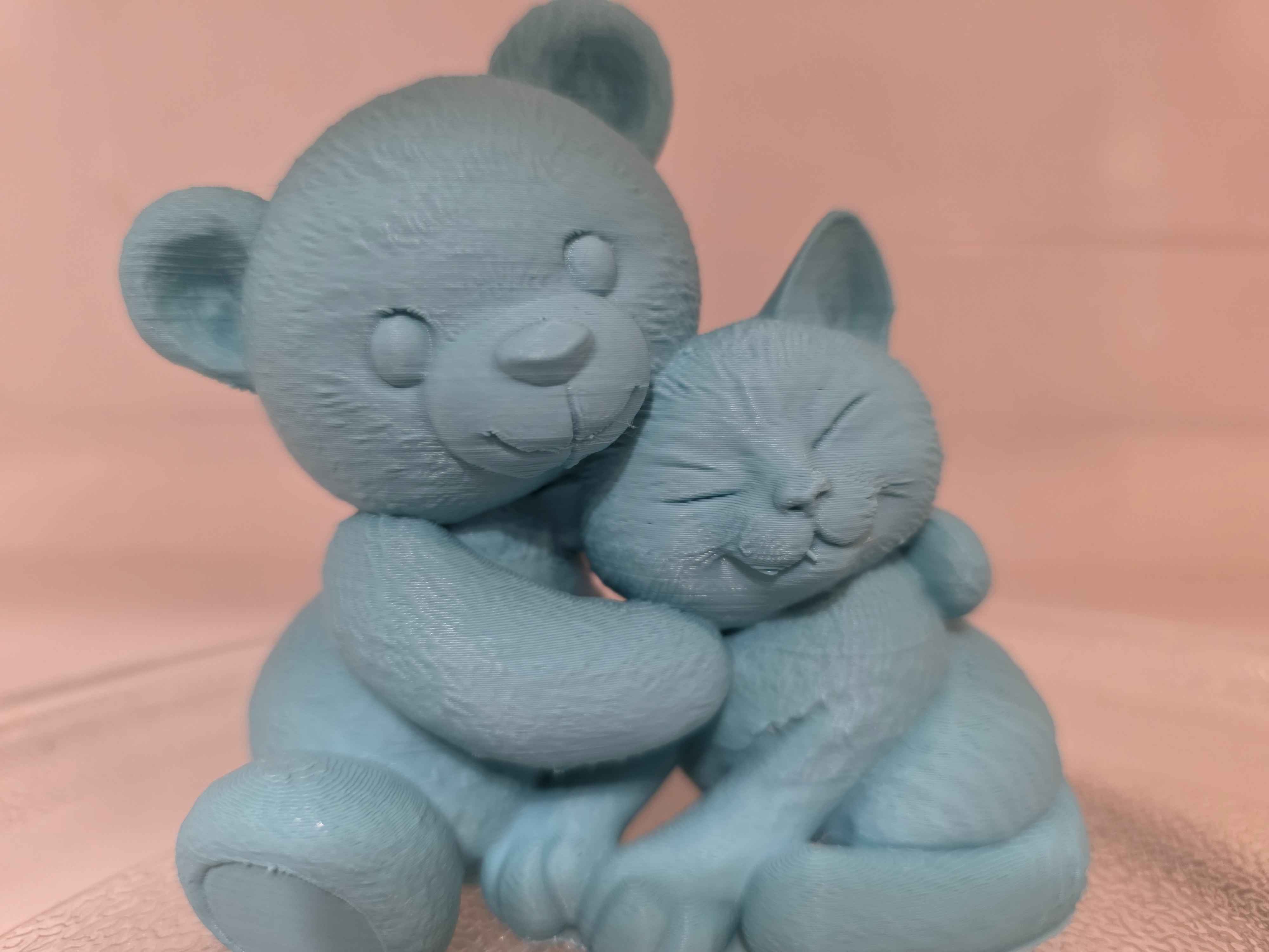 Cuddling Teddy Bear And Cat