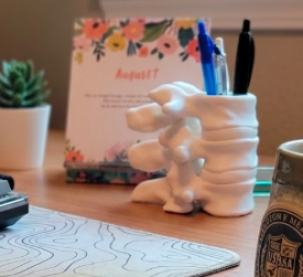 Spine pen holder
