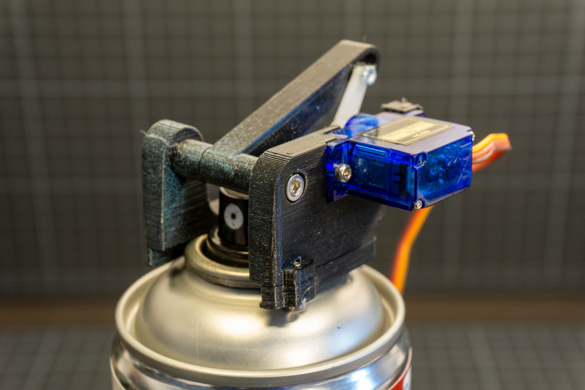 Motorized Spray Can Cap Trigger