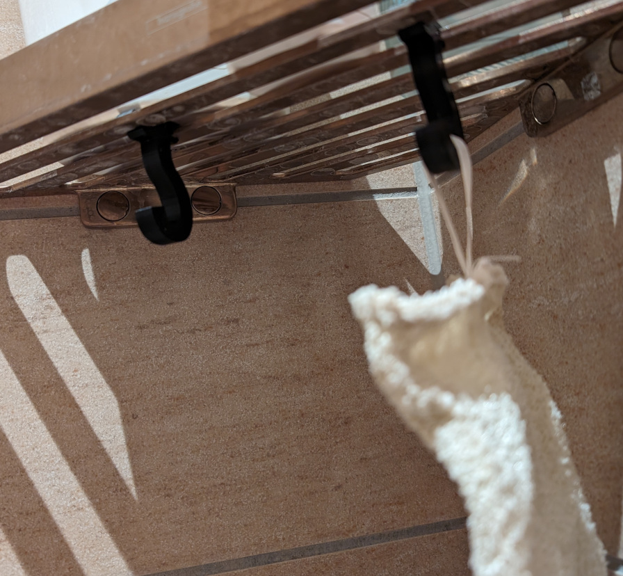 Hook for mounting under Hansgrohe AddStoris Q Corner basket