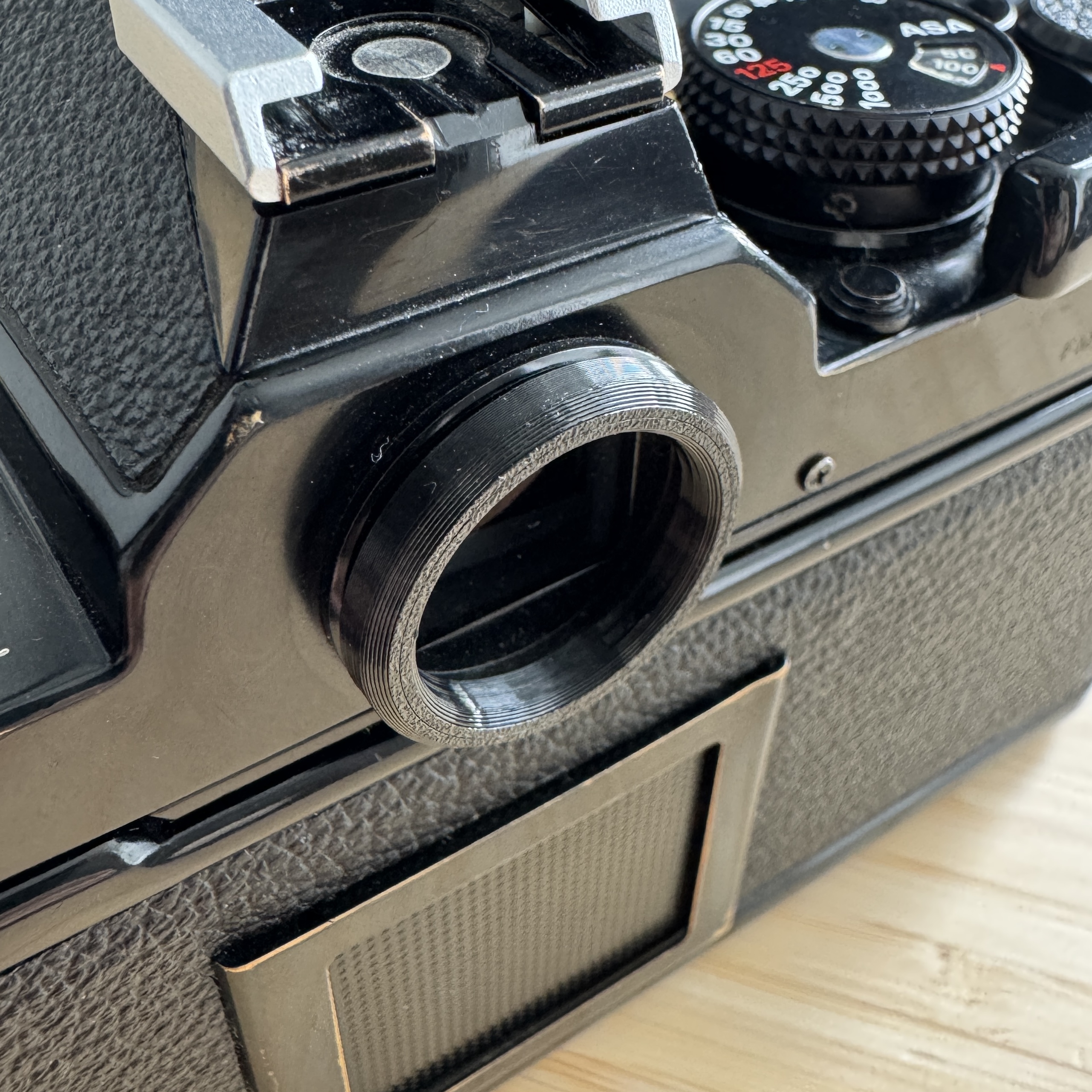 Low-profile eyepiece for Nikon FM/FE/FM2/FE2