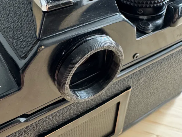 Low-profile eyepiece for Nikon FM/FE/FM2/FE2