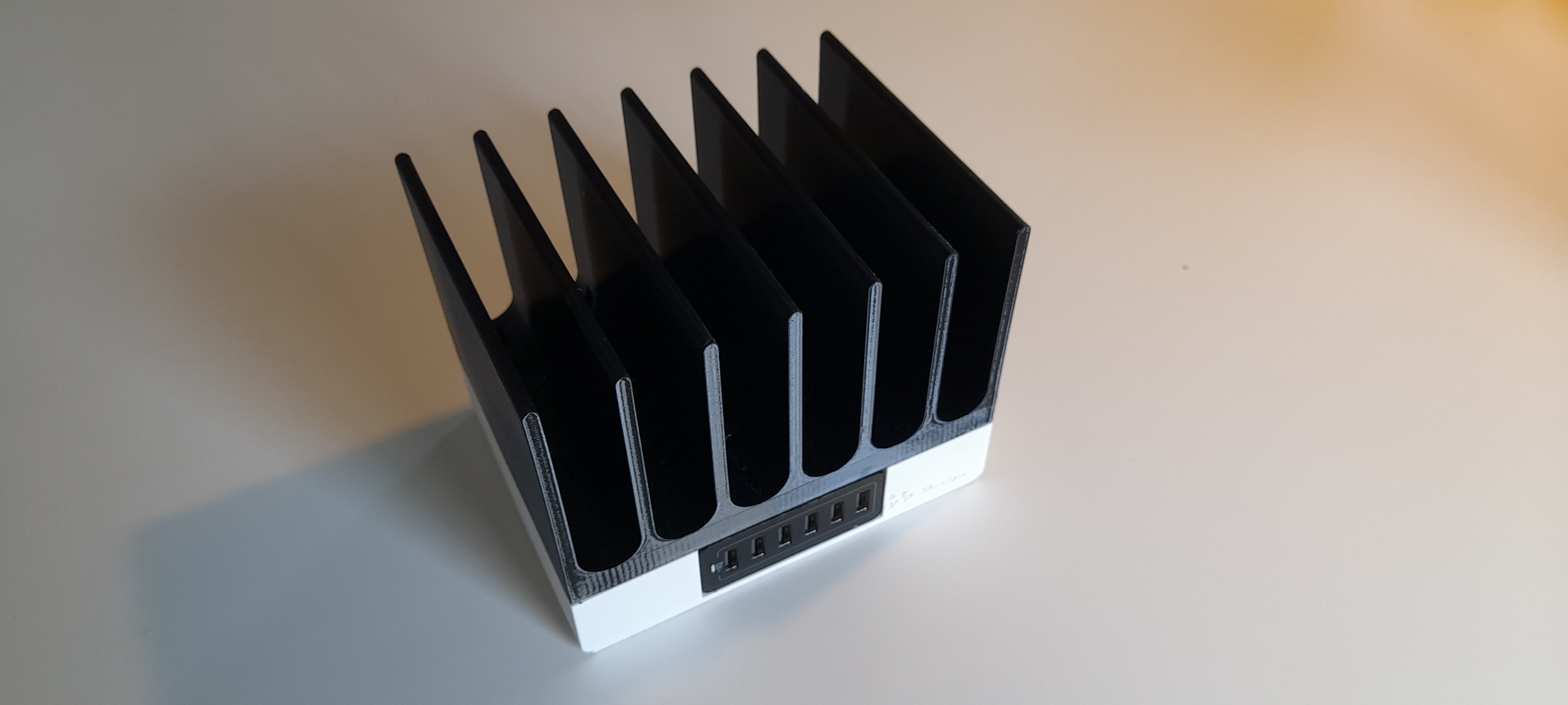 Stackable, Wall-Mountable Charging Station for Smartphones, etc.