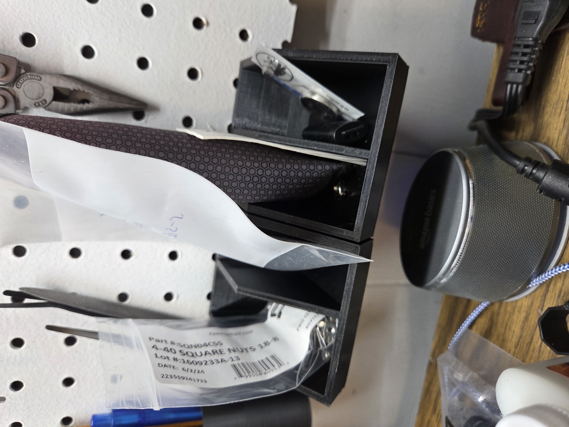 Pegboard tray with added central divider.