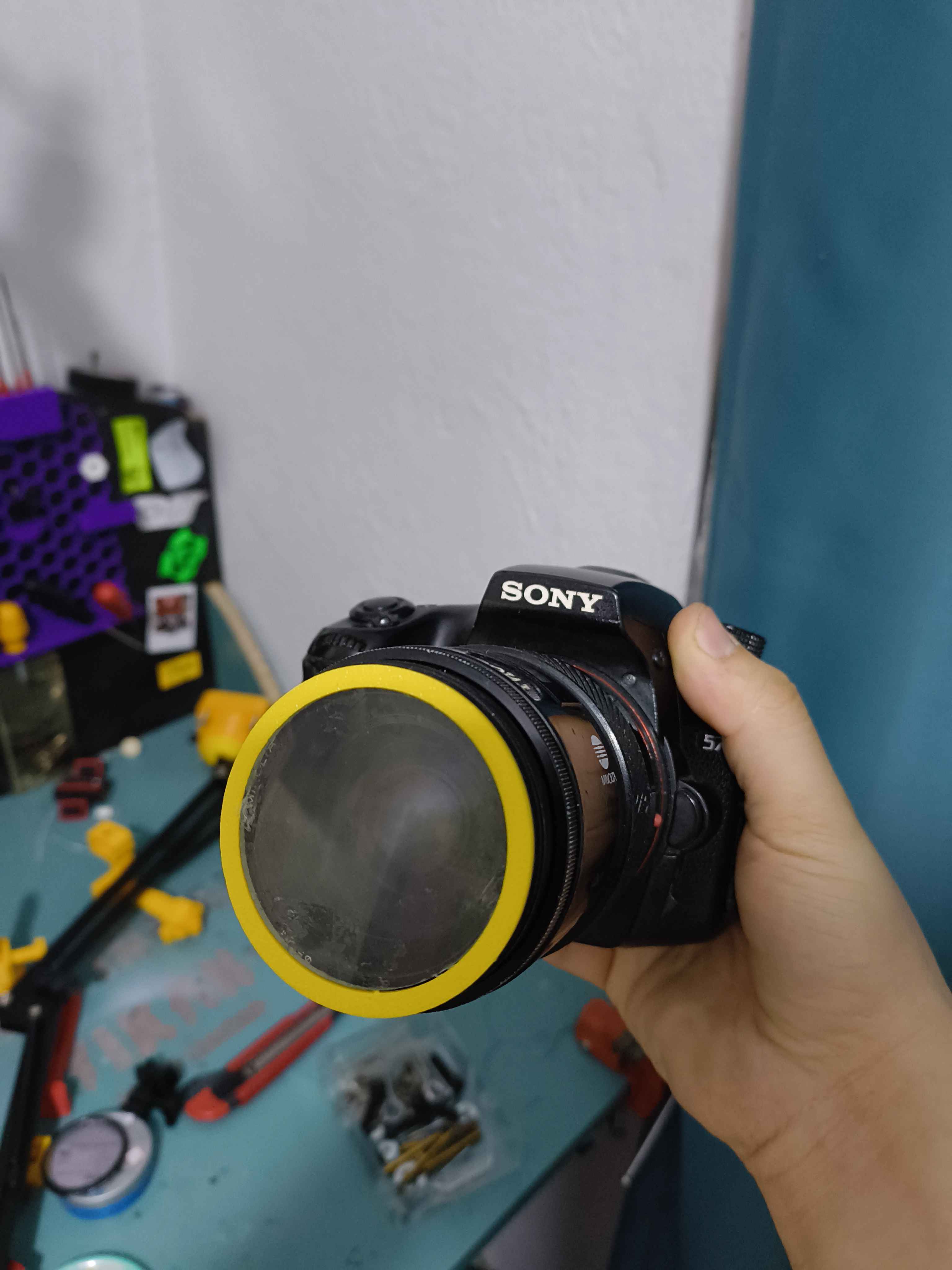 Sony A mount lens filter to 50mm magnifying lens adapter.