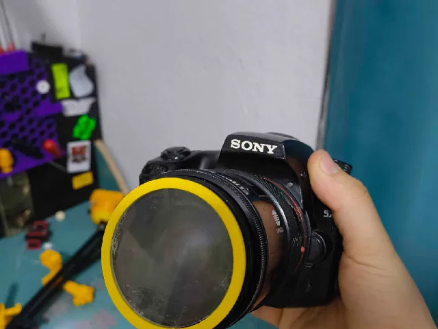 Sony A mount lens filter to 50mm magnifying lens adapter.