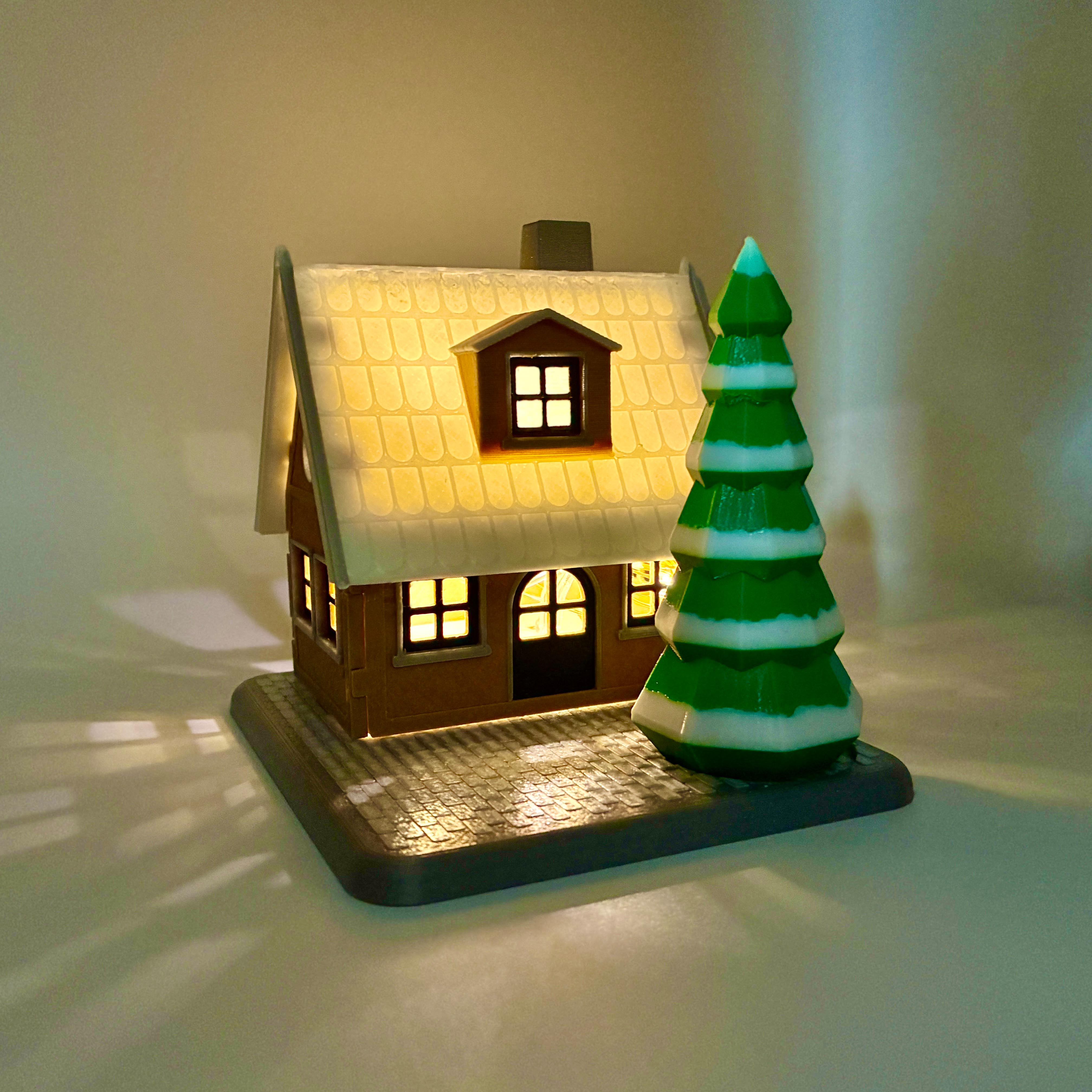 Winter- Haus mit Tannenbaum