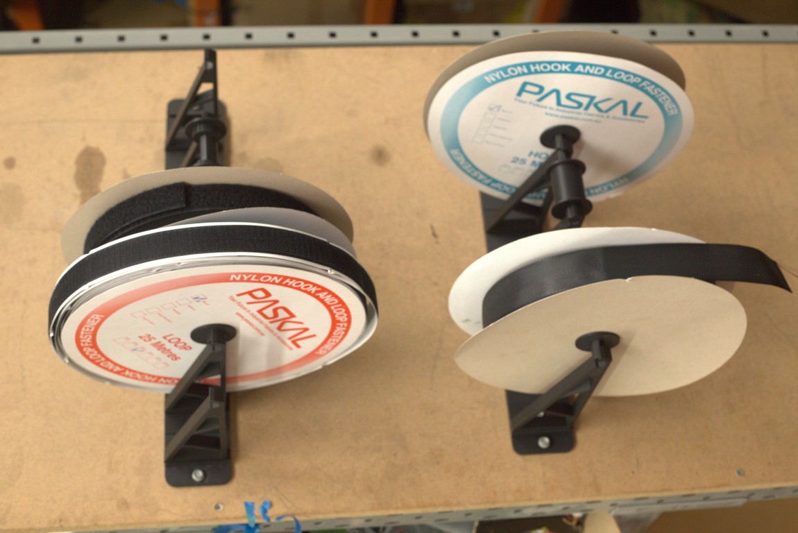 Modular wall mounted webbing and binding rack