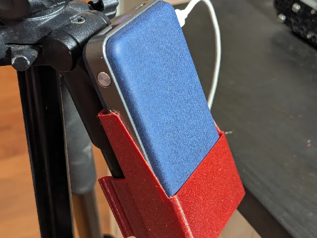Camera tripod power bank holder