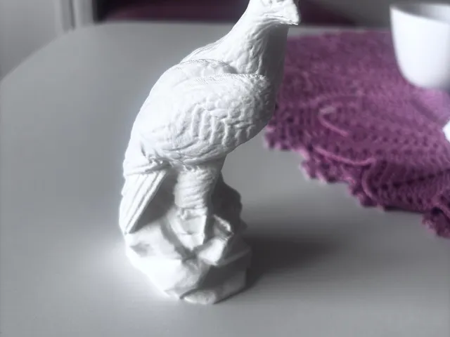 Bird Perched on Rock Statue