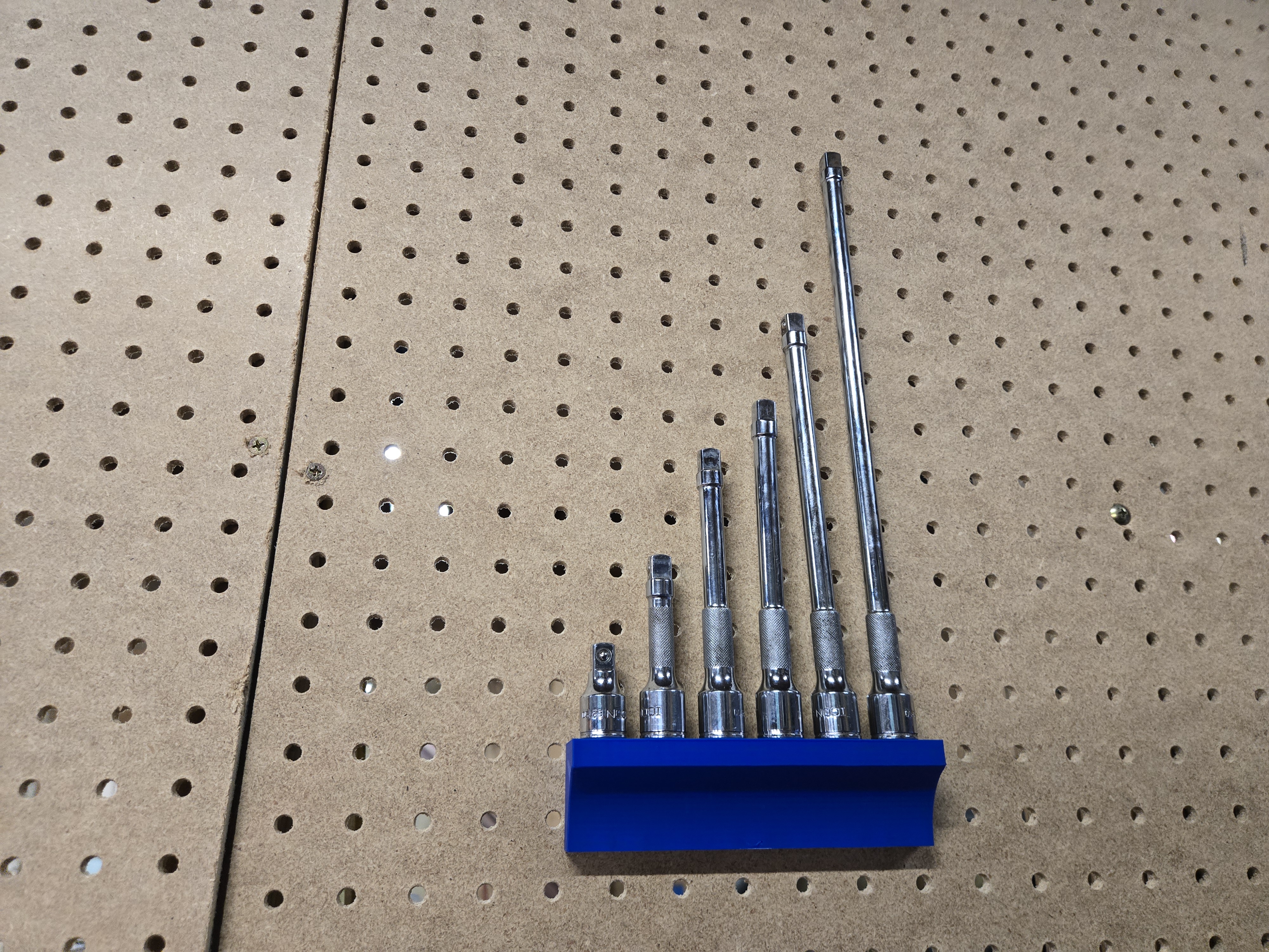 Extension holder universal pegboard mount