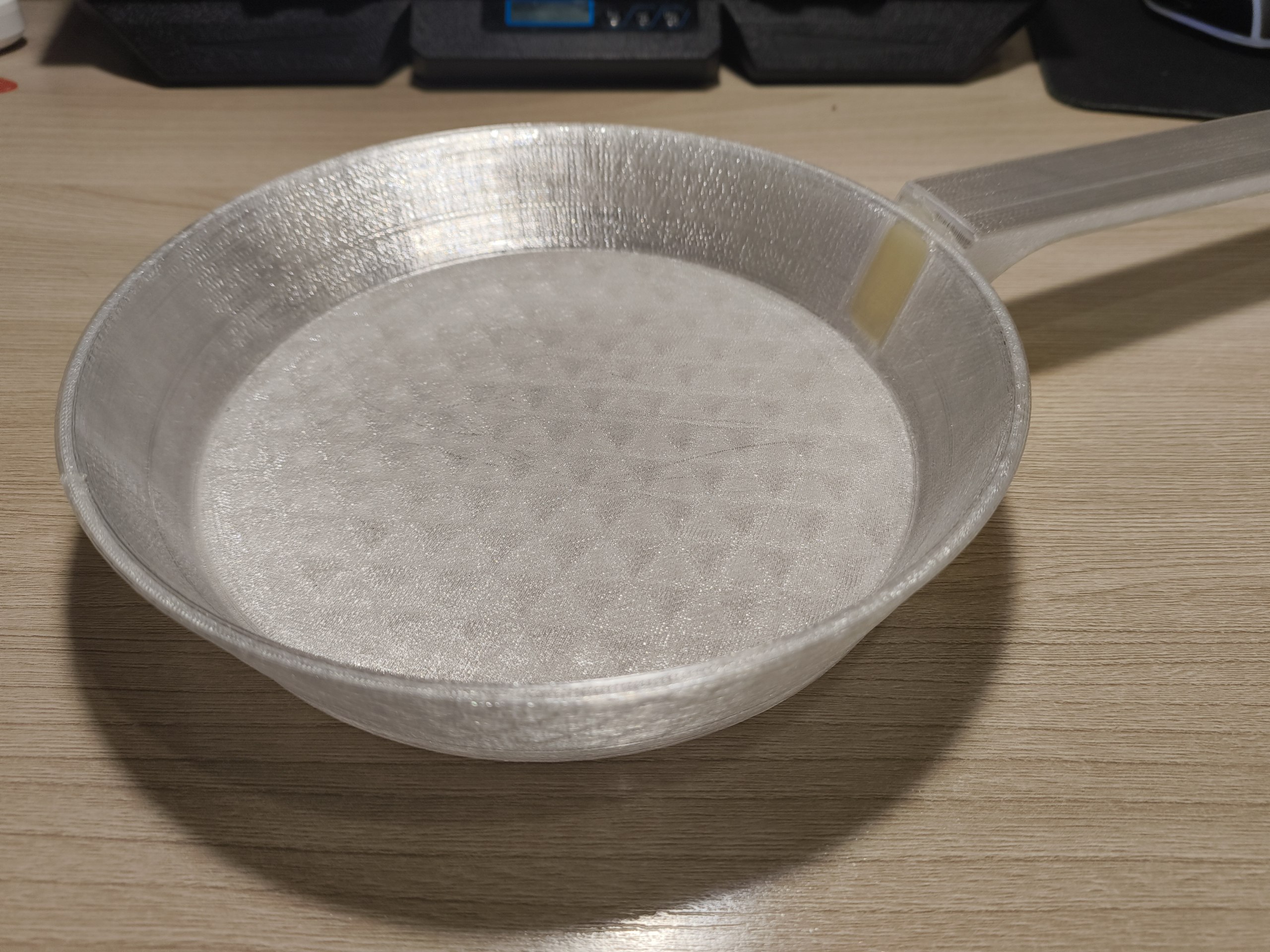 A frying pan and a handle for it