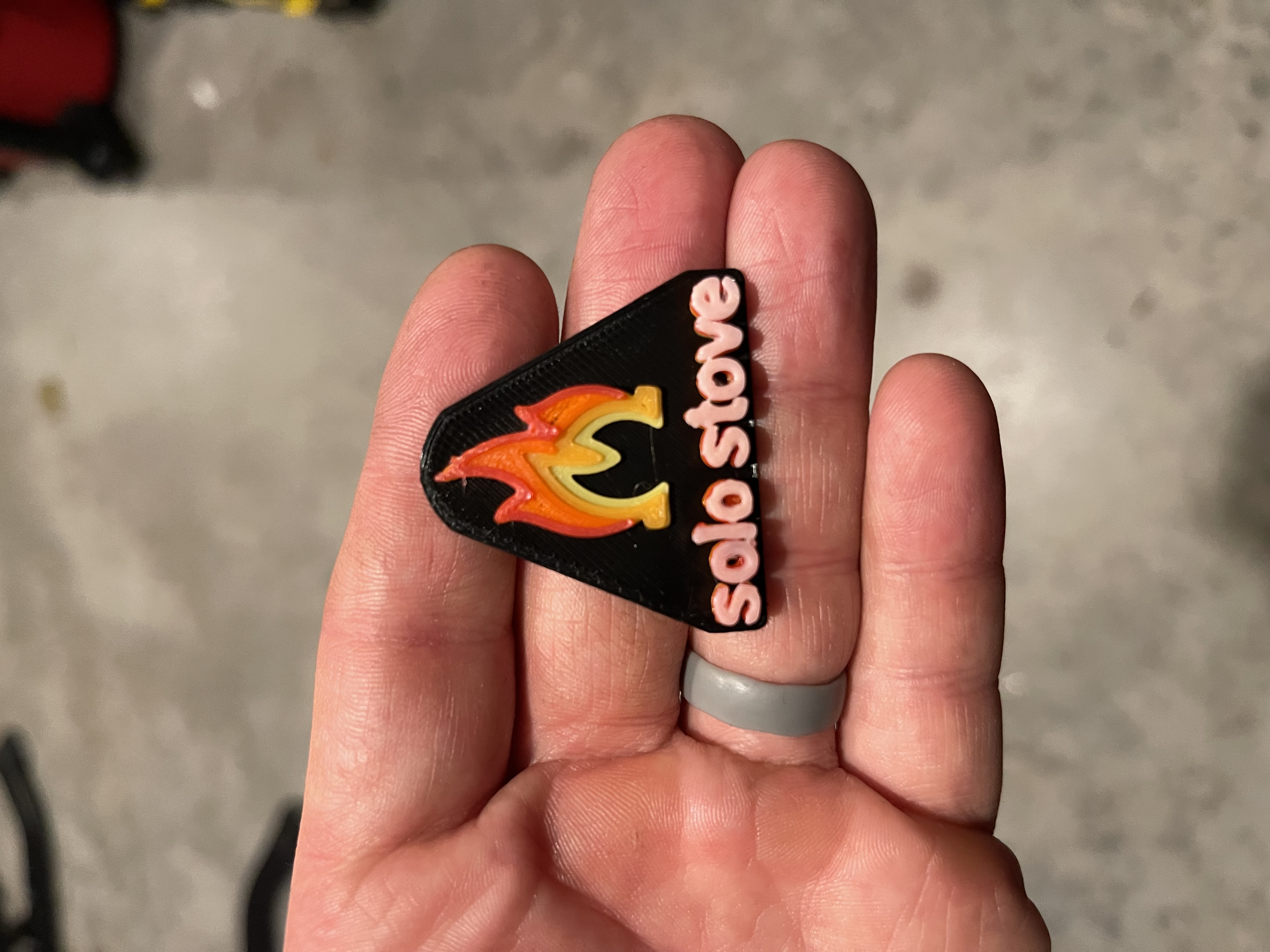 Solostove logo (with multicolored flame)
