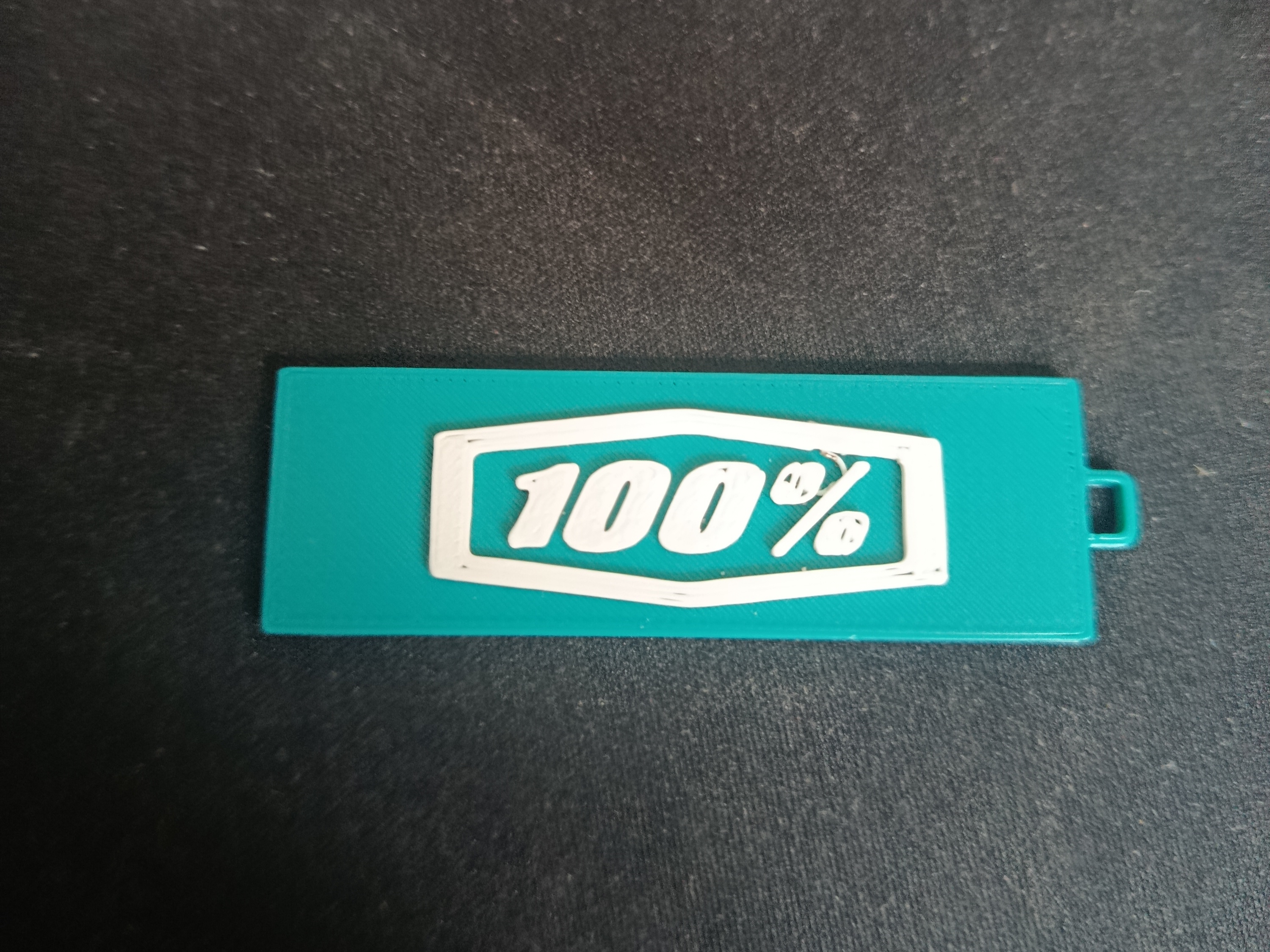 100% keychain
